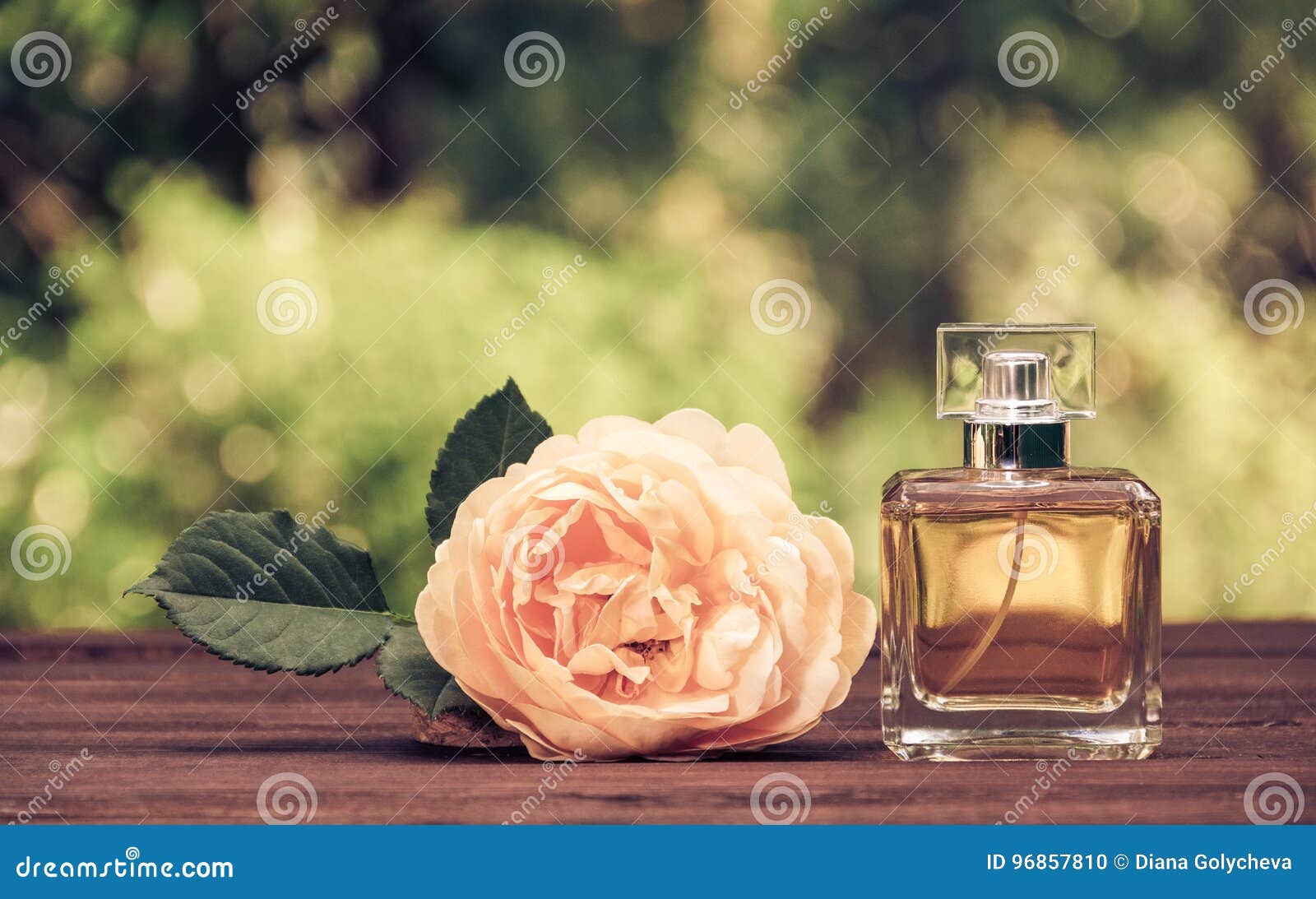 A Perfume Bottle and a Fragrant Yellow Rose. Natural Perfume in a ...