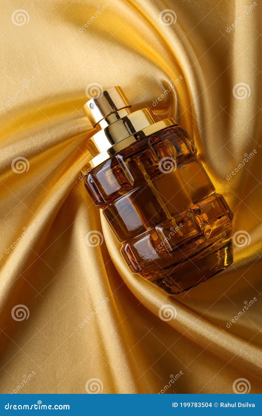 Perfume Bottle on Gold Silk Folded Fabric Background Fragrance Perfume ...