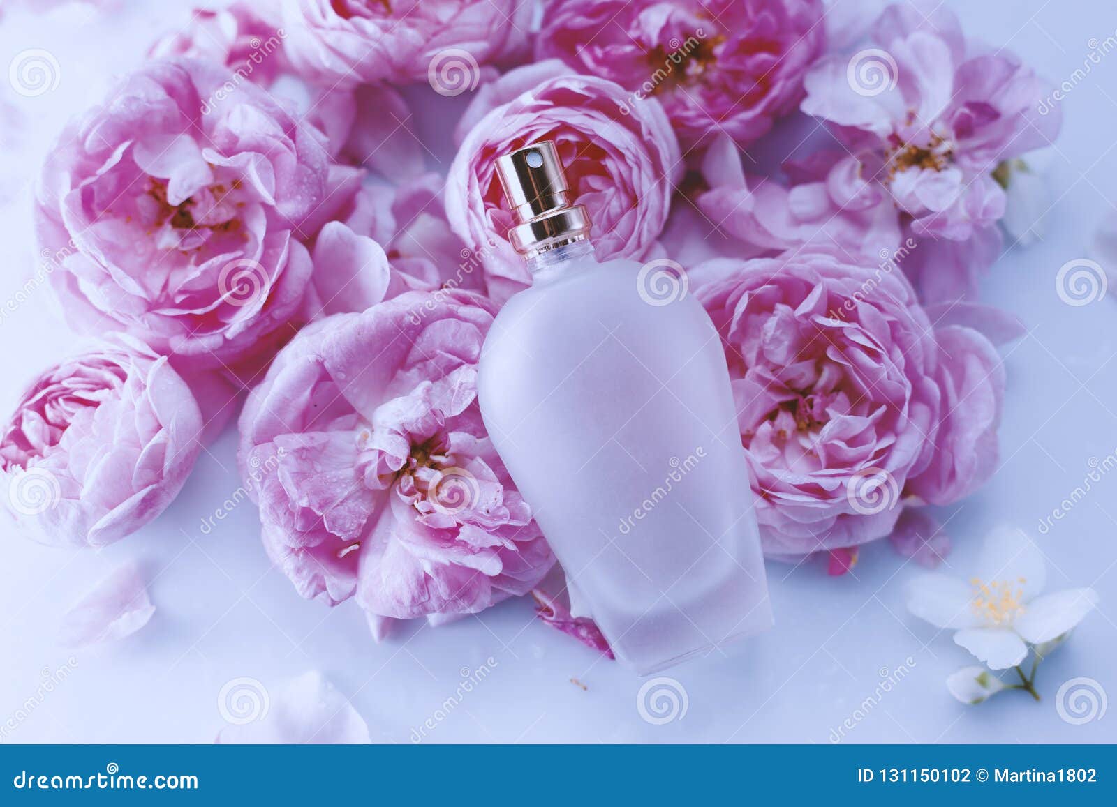 Perfume and flowers stock photo. Image of closeup, fashion 131150102