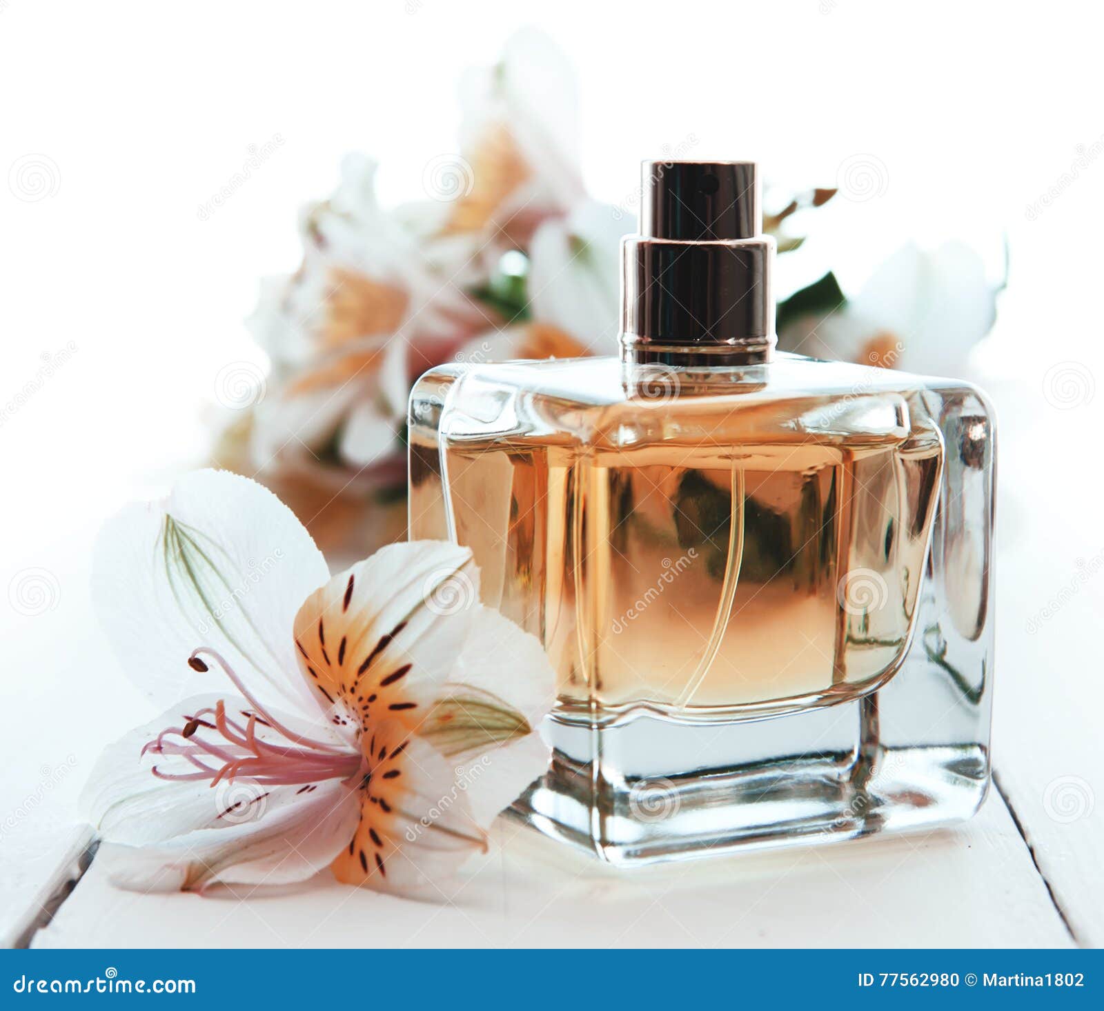 Perfume with flowers stock photo. Image of container 77562980