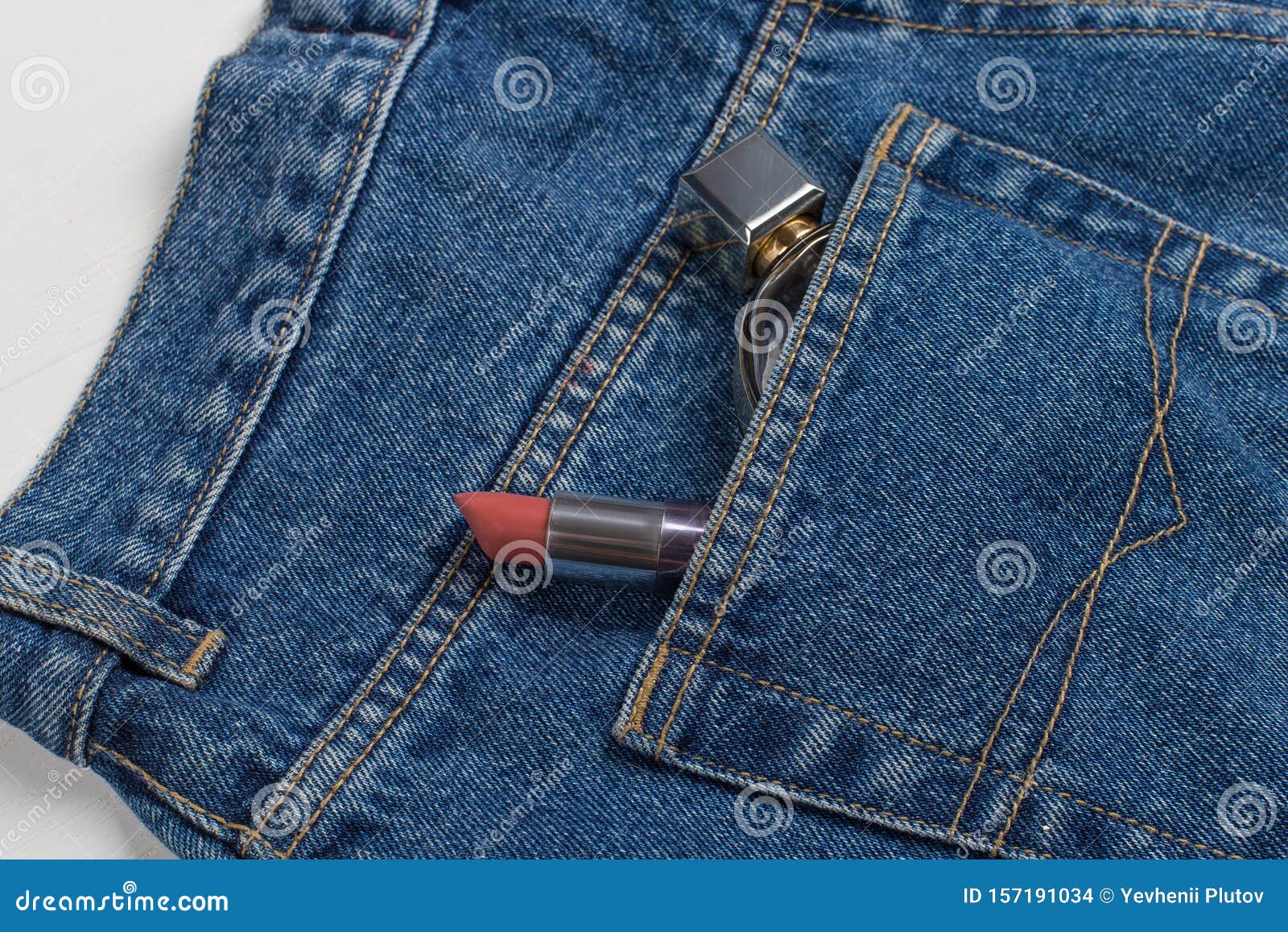 Perfume and Lipstick in a Pocket of Blue Jeans Stock Photo - Image of ...