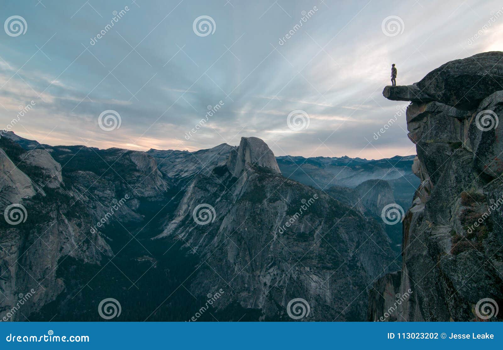 perhaps the best view of glacier point where this unknown adventurer dares to stand on the edge