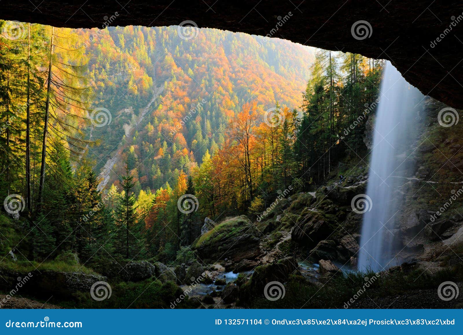 pericnik falls, waterfall with orange tree in triglav national park, slovenia. landscape in nature europe. foggy triglav alps