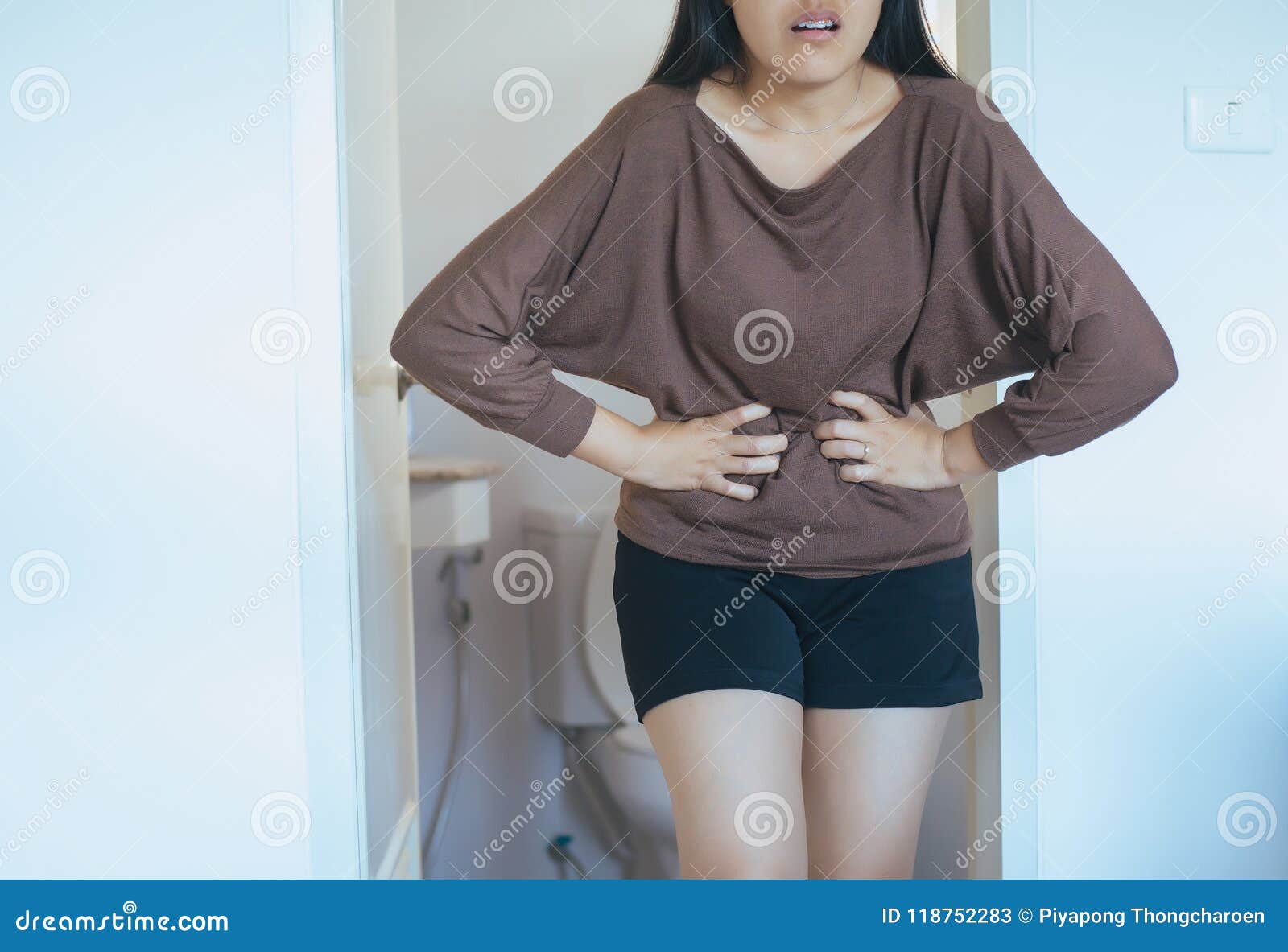 period cramp,asian woman having painful stomachache,female suffering from abdominal pain