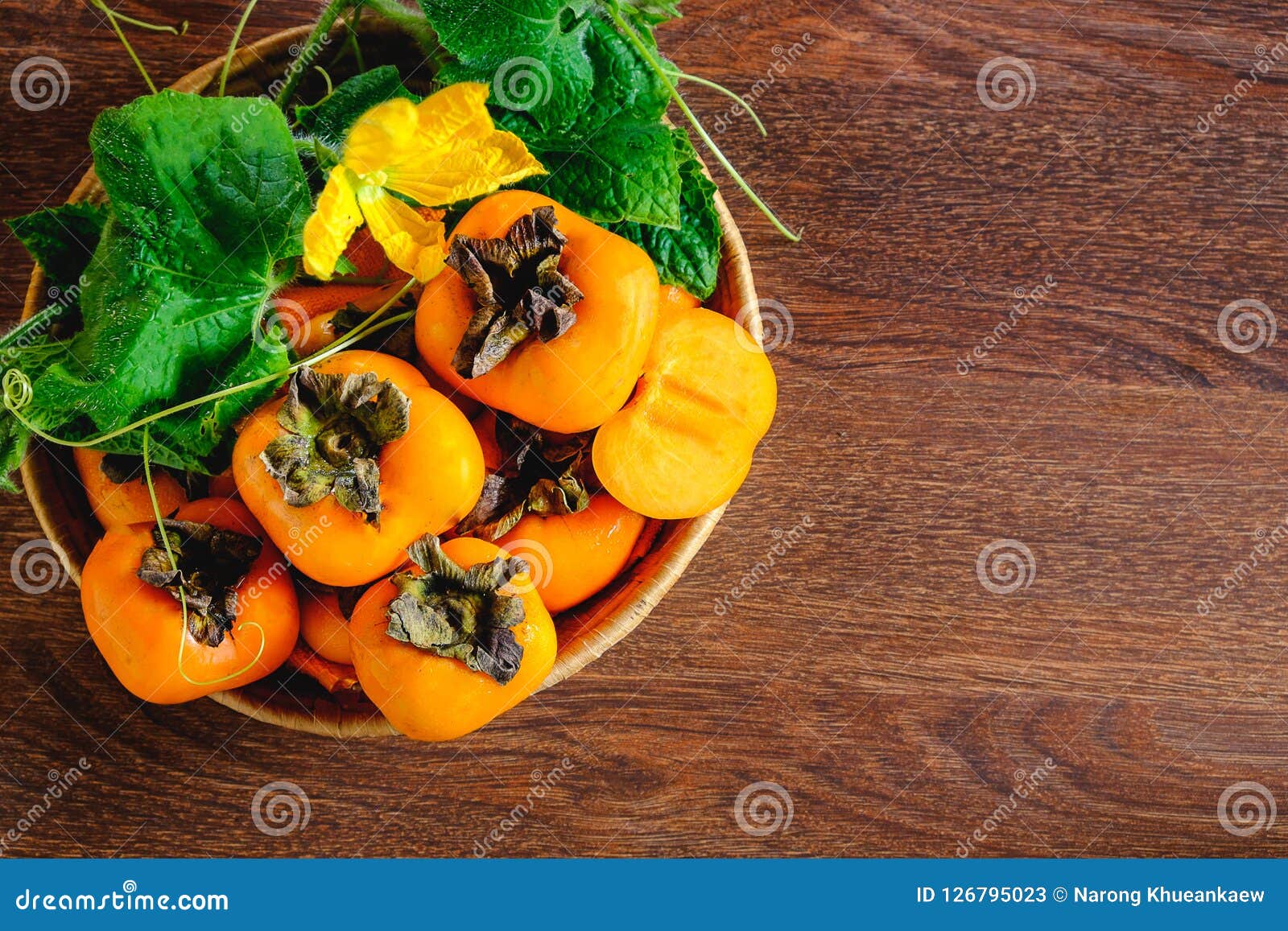 Persimmon in a basket stock image. Image of ingredient 126795023