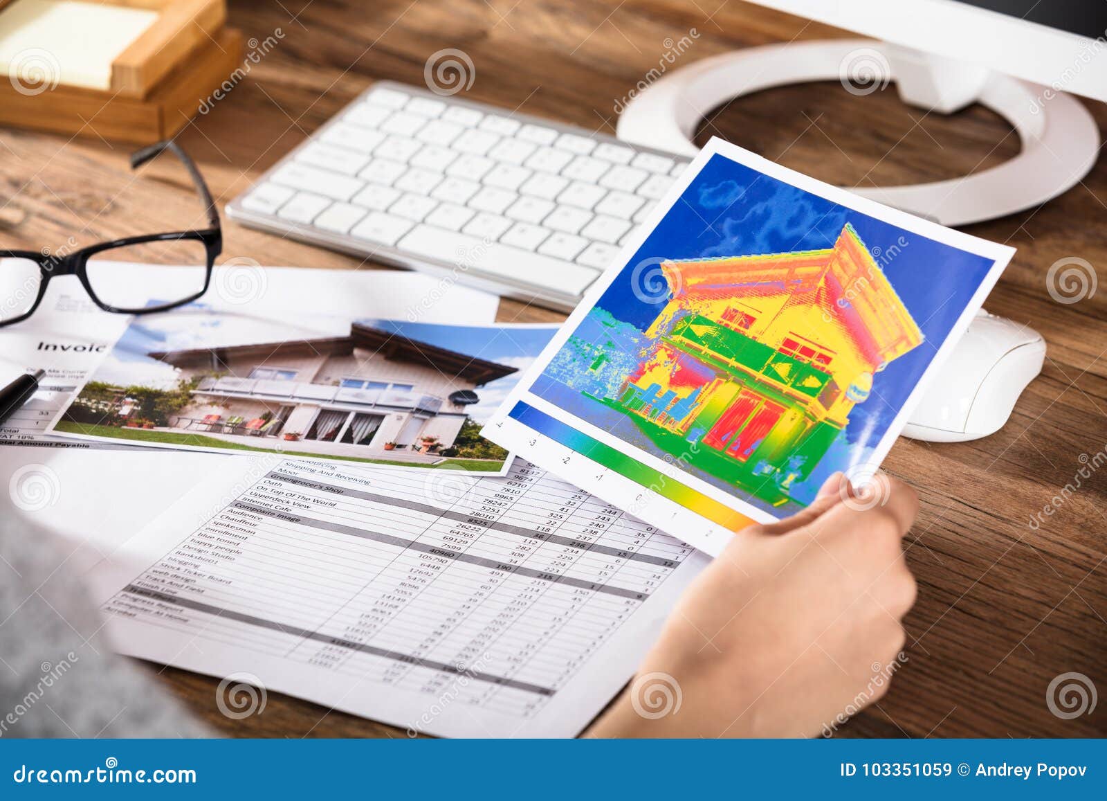 person analyzing the thermal image of a house