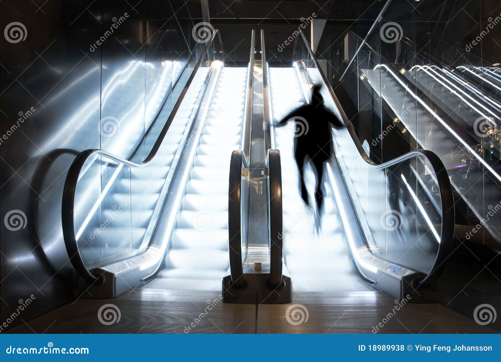 Person in escalator stock photo. Image of glass, future 18989938