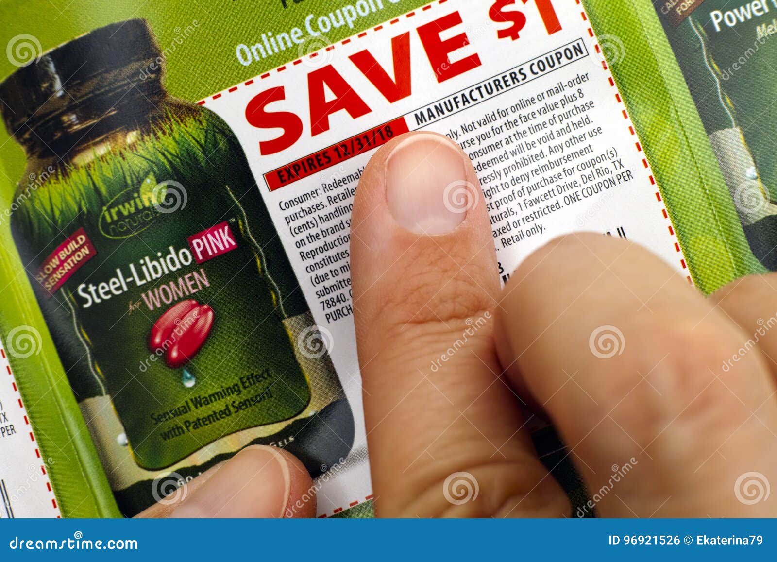 Person Fingers On Irwin Naturals Discount Coupon. Editorial Photo