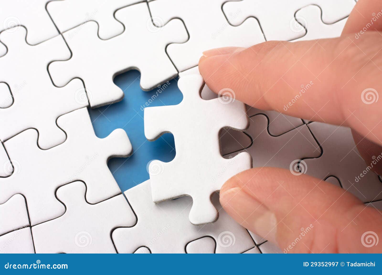 A Person Fitting the Last Puzzle Piece. Stock Image Image of business