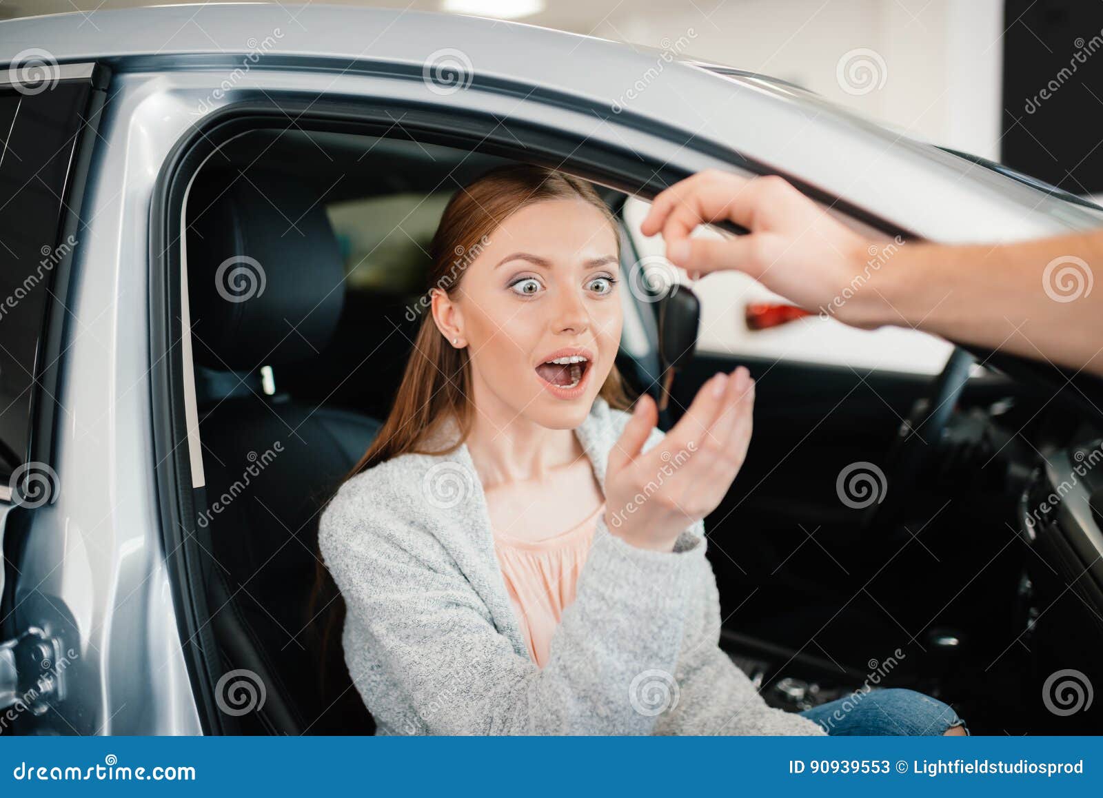 Person Giving Car Key To Excited Woman Sitting in Car Stock Image ...