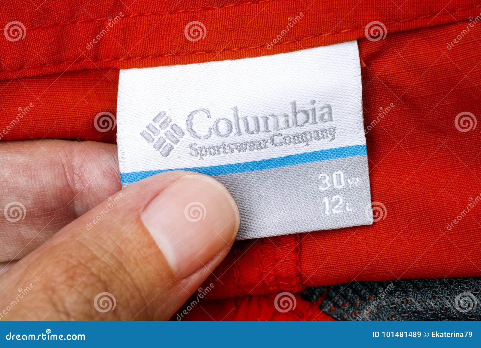 Person Hand with Columbia Sportswear Company Clothes Label