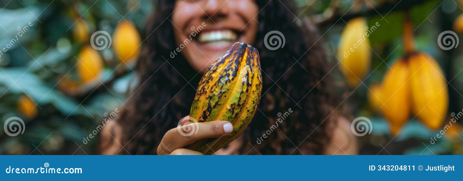 a person holding a cacao pod and smiling conveying the joy and satisfaction of discovering the mildly sweet hydration of