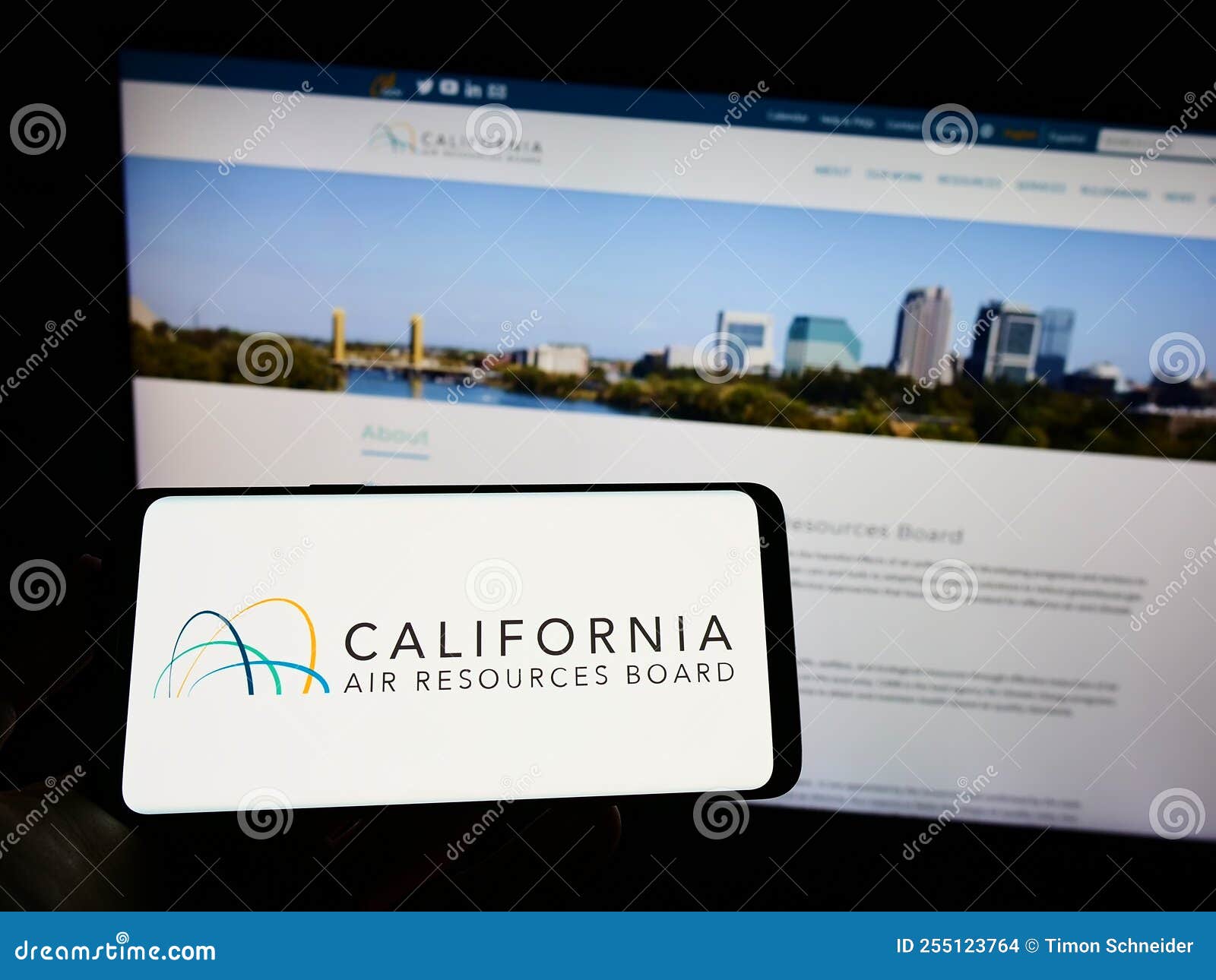 person-holding-cellphone-with-logo-of-california-air-resources-board