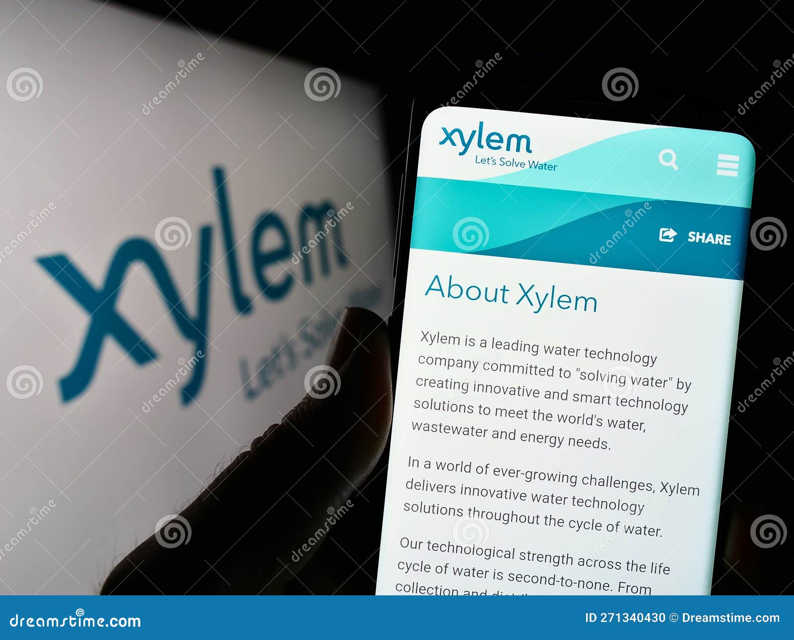 Logo of public company Xylem Inc. displayed on a smartphone. Grey  background. Credit: PIXDUCE Stock Photo - Alamy