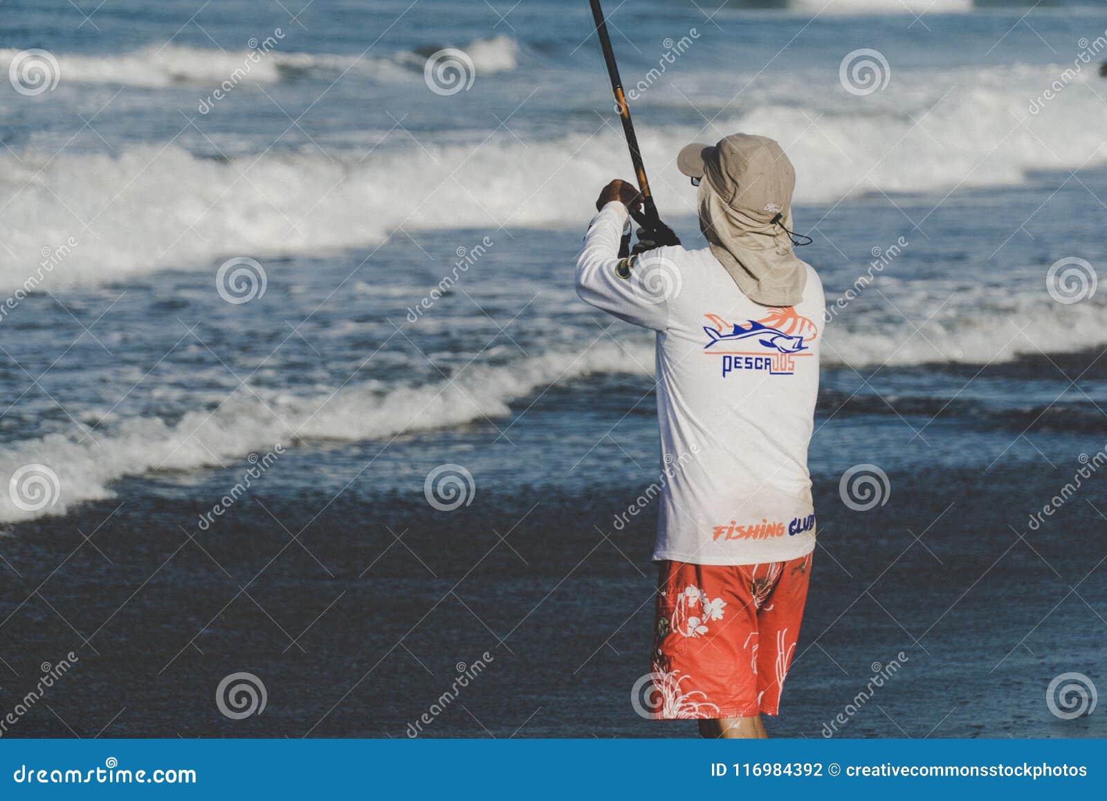 https://thumbs.dreamstime.com/z/person-holding-fishing-rod-beach-116984392.jpg