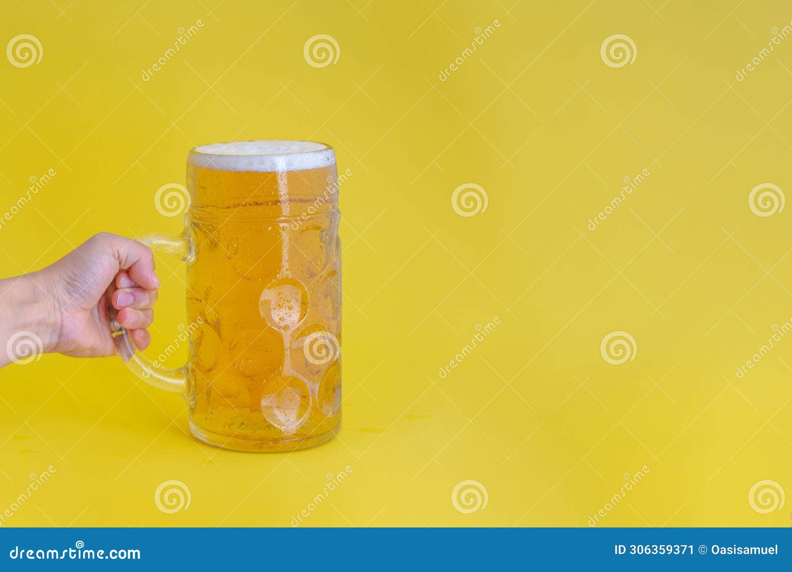 a person holding an oktoberfest glass beer stein or giant one litre beer glass stein tankard
