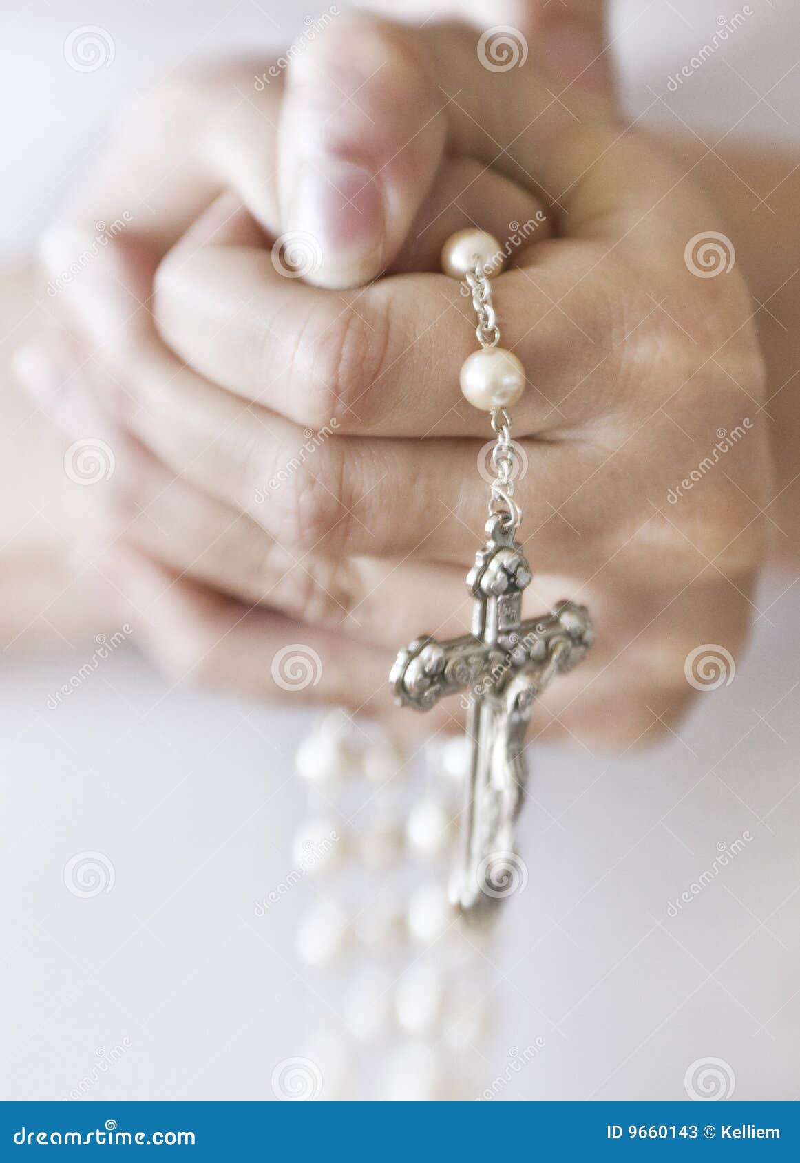 person holding rosary beads