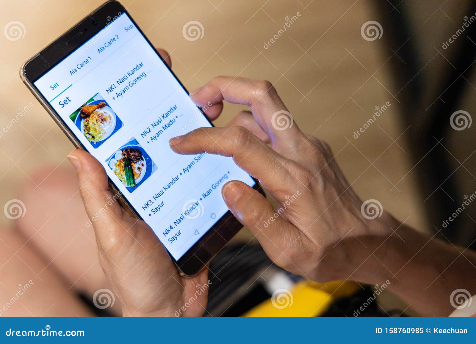 person ordering food online via app on smart phone