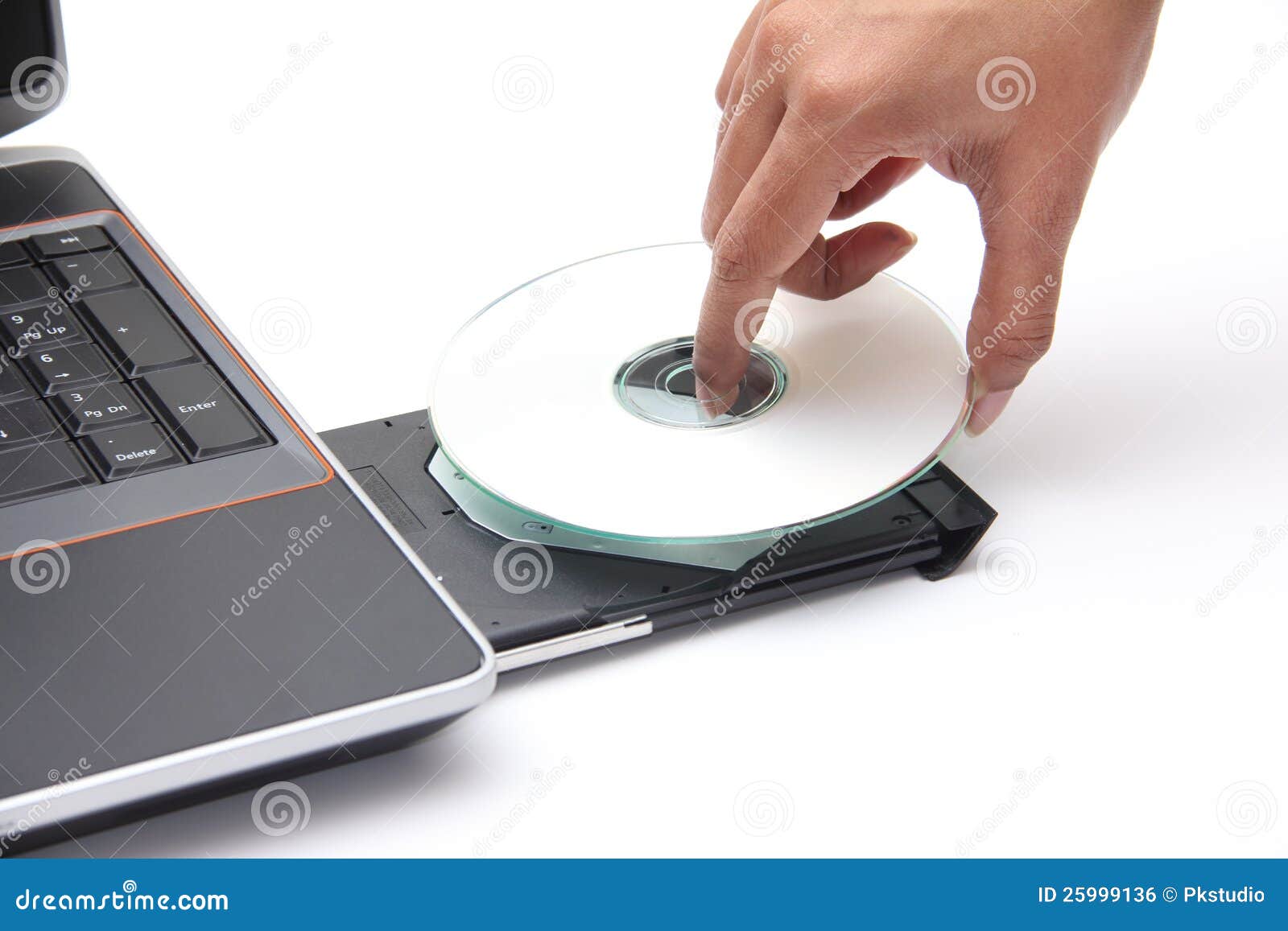 person placing a compact disc in the cdrom drive