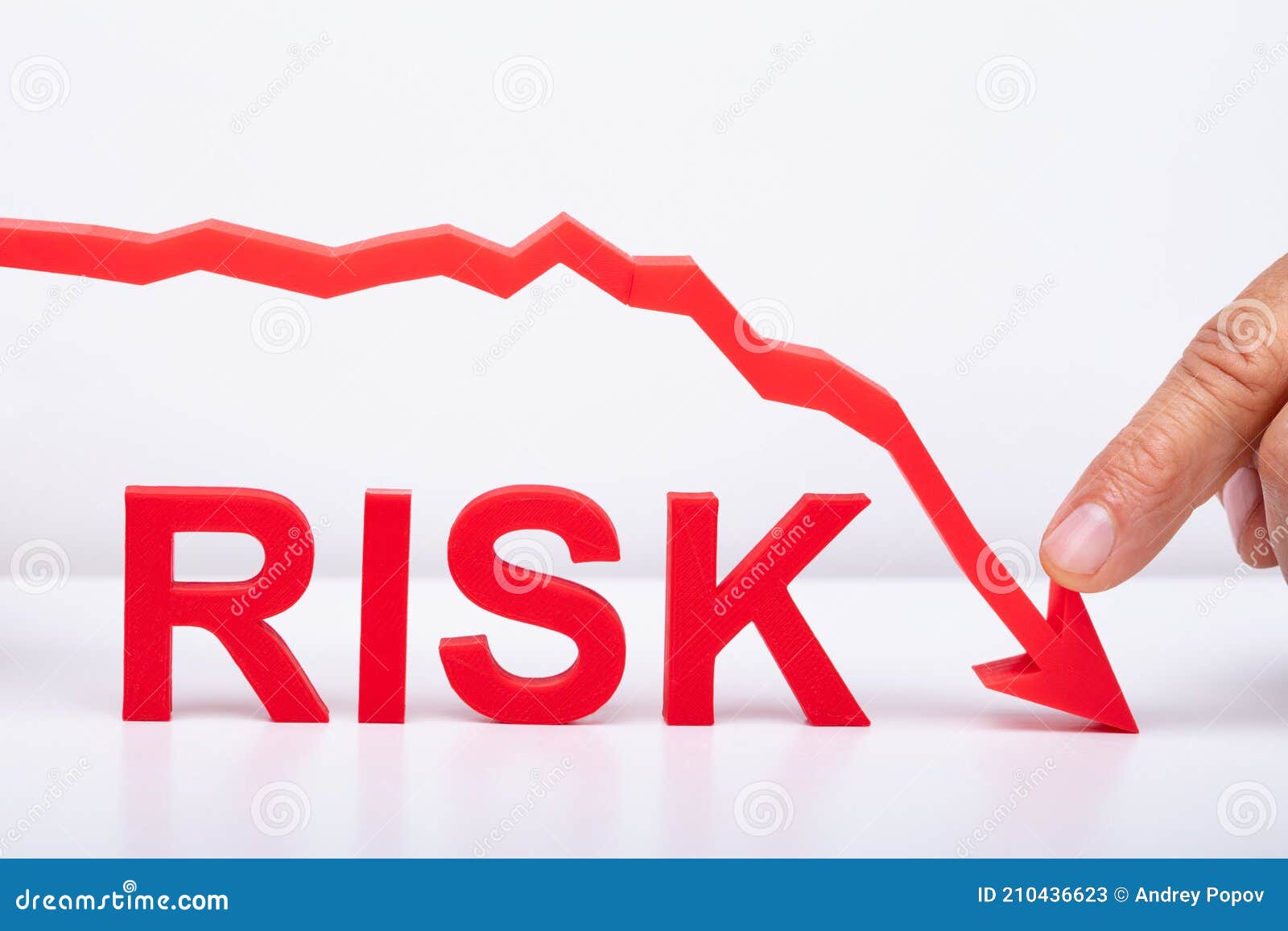 Person Pointing Diminishing Arrow Over the Risk Stock Image - Image of