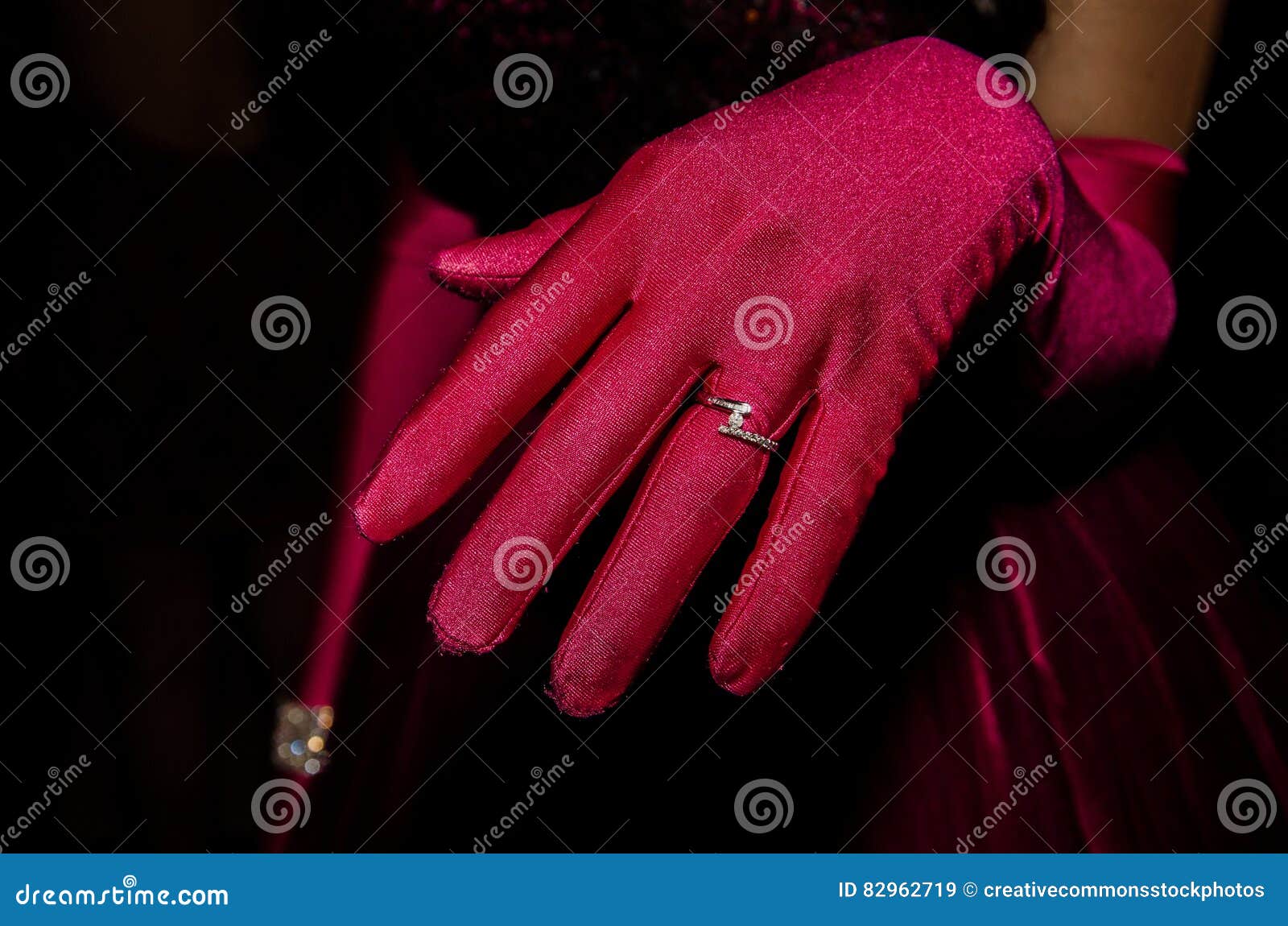 Person In Red Glove With Silver Ring Picture. Image 82962719