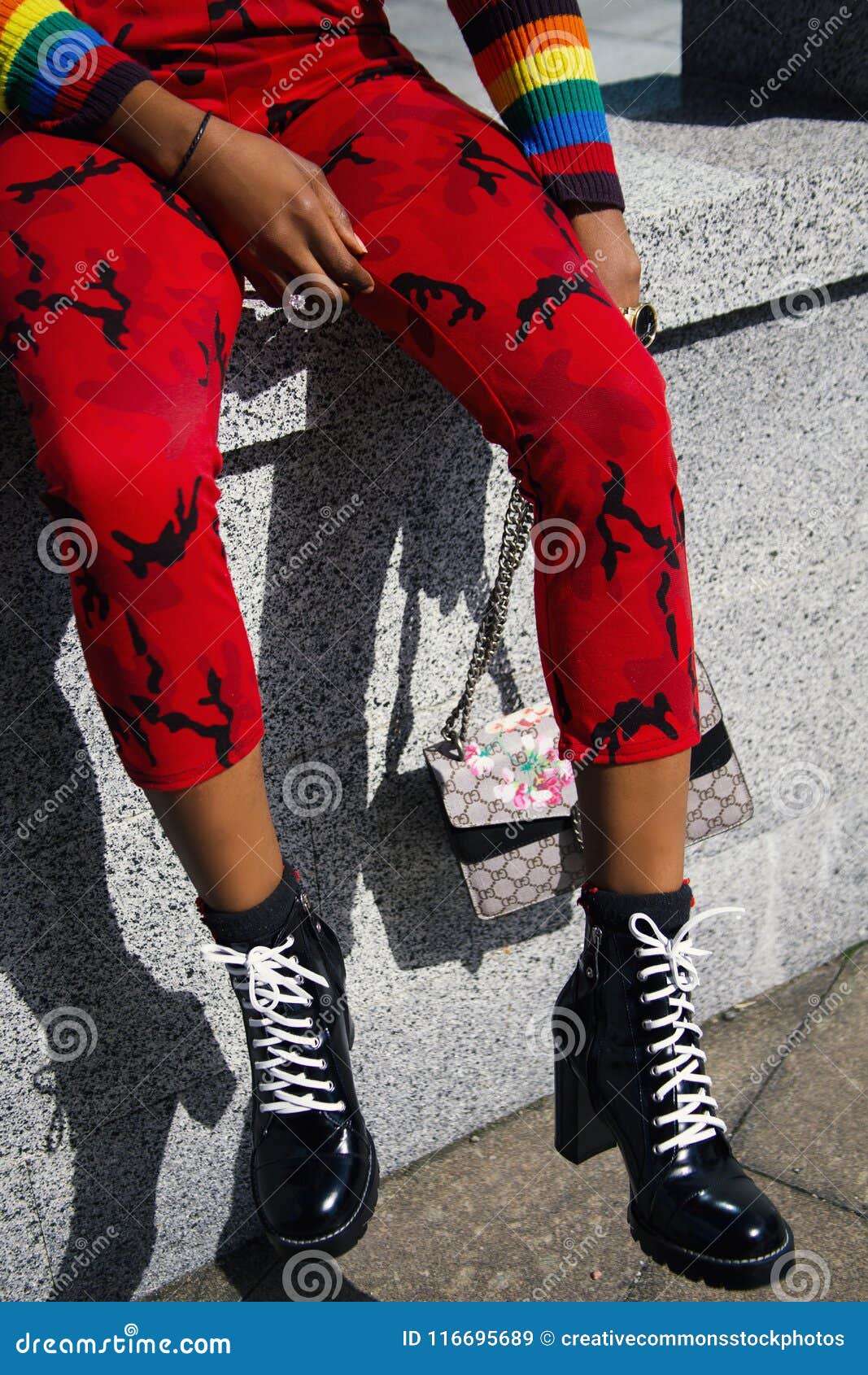 Person In Red Pants And Pair Of Black Heeled Boots Picture. Image 116695689