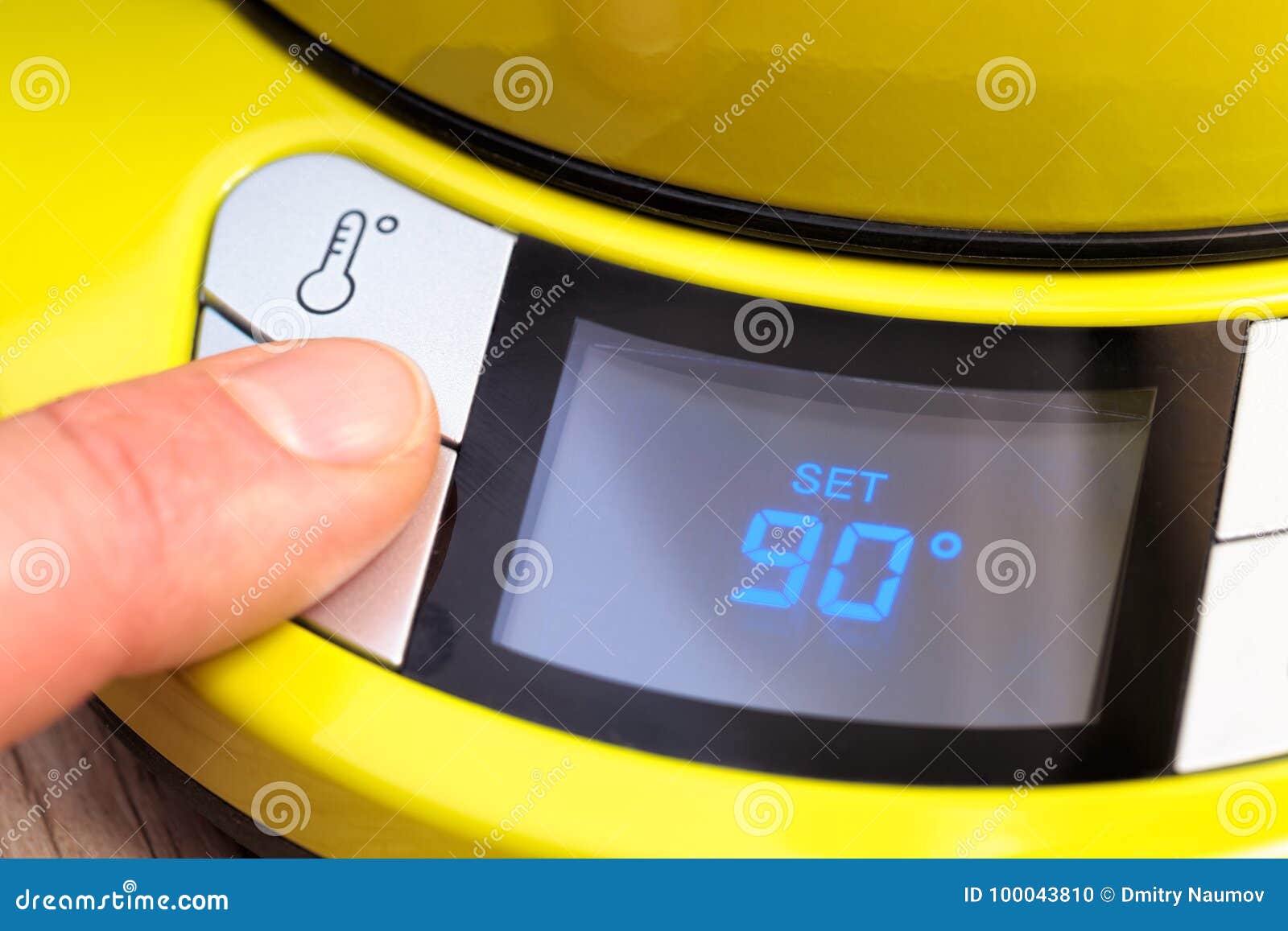 Person Setting Electric Tea Kettle Temperature To 90 C Stock Photo