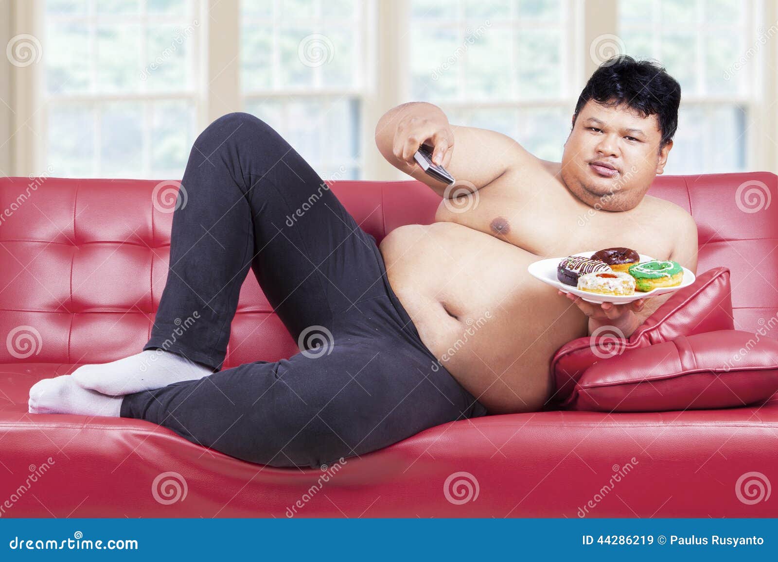 Person Sitting On Sofa With Donuts Stock Image Image Of Healthy
