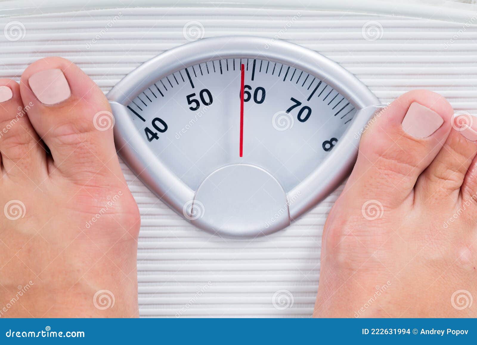 Person Standing On A Weight Scale Weighing Themselves Stock