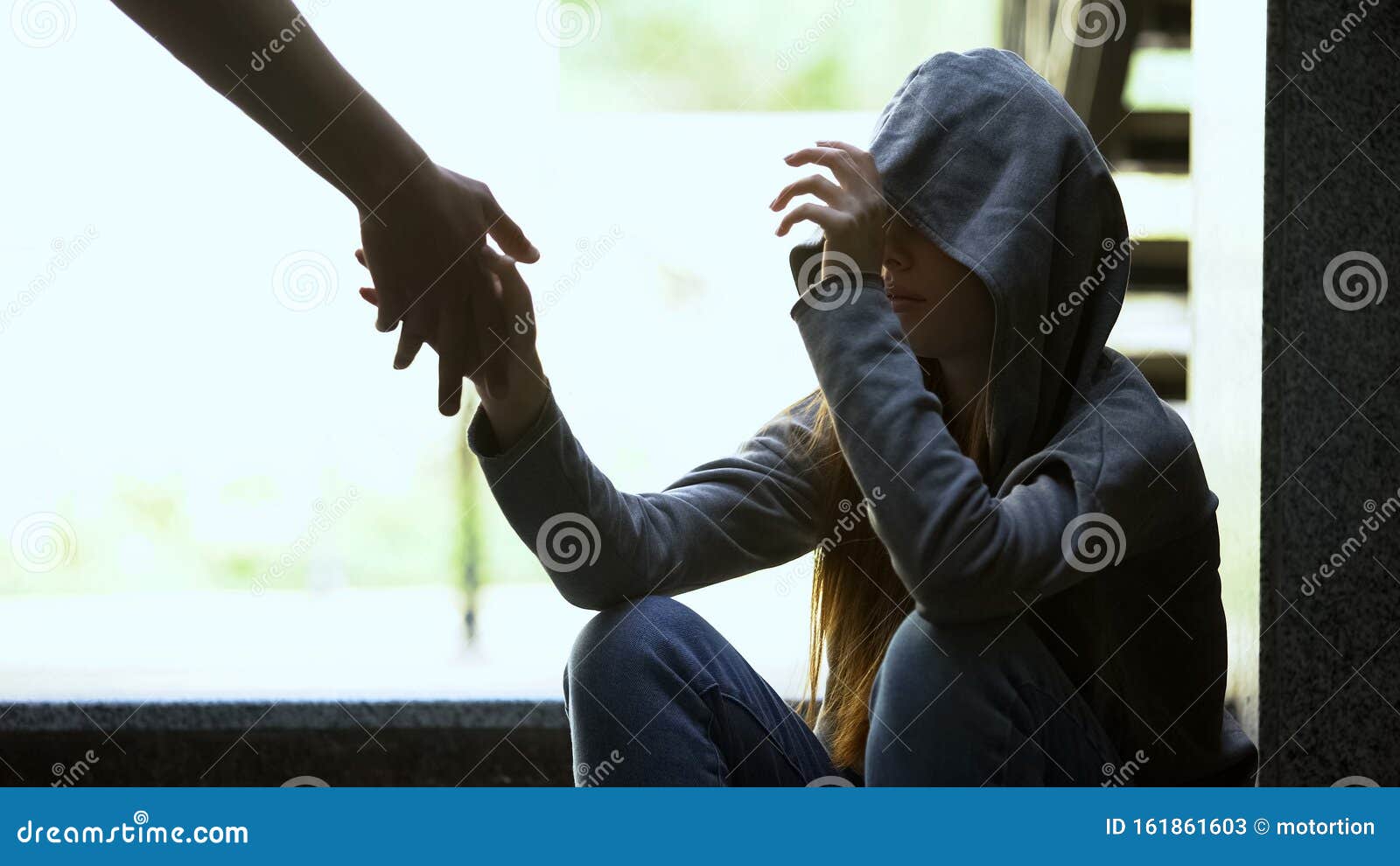 person stretching helping hand to lonely depressed teen girl, support and aid