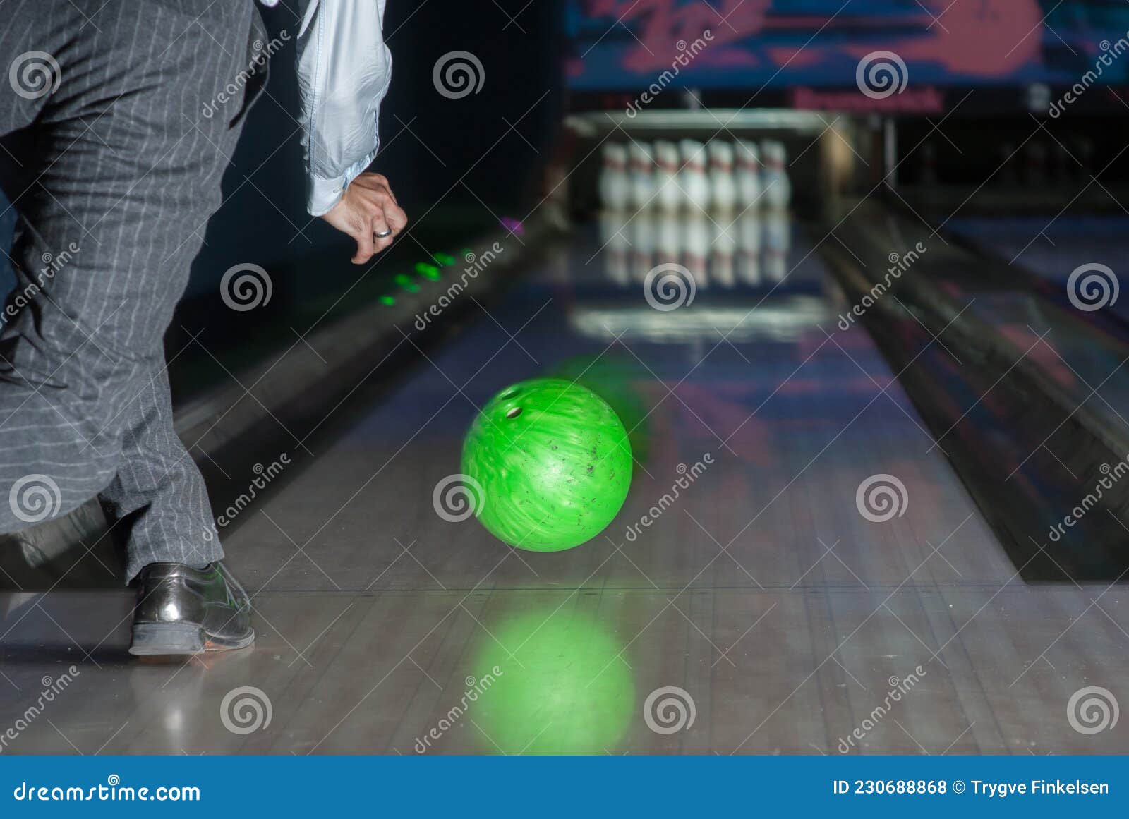 Person Throwing a Green Bowling Ball Stock Photo Image of closeup