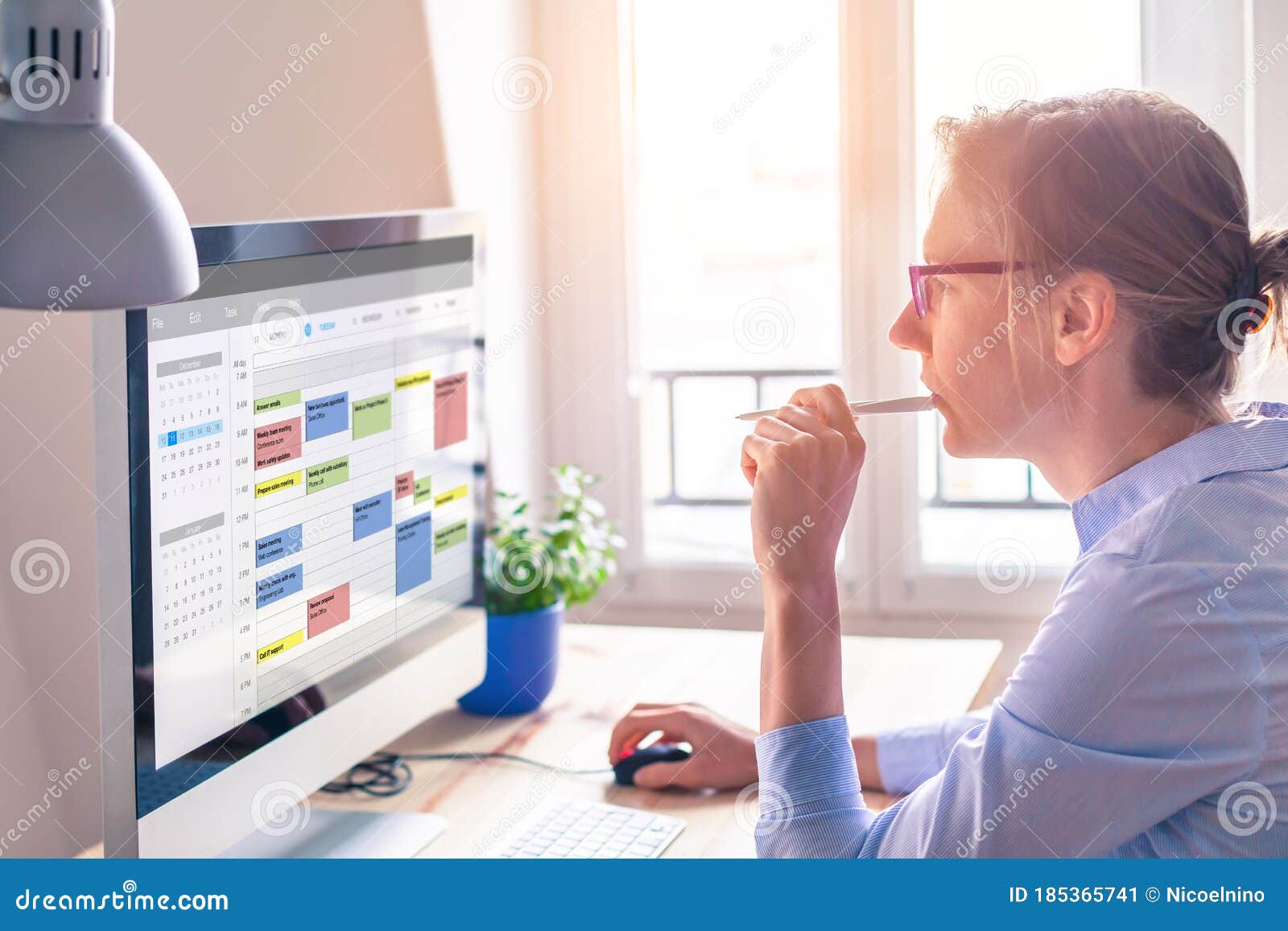 person using calendar on computer to improve time management, plan appointments, events, tasks and meetings efficiently, improve