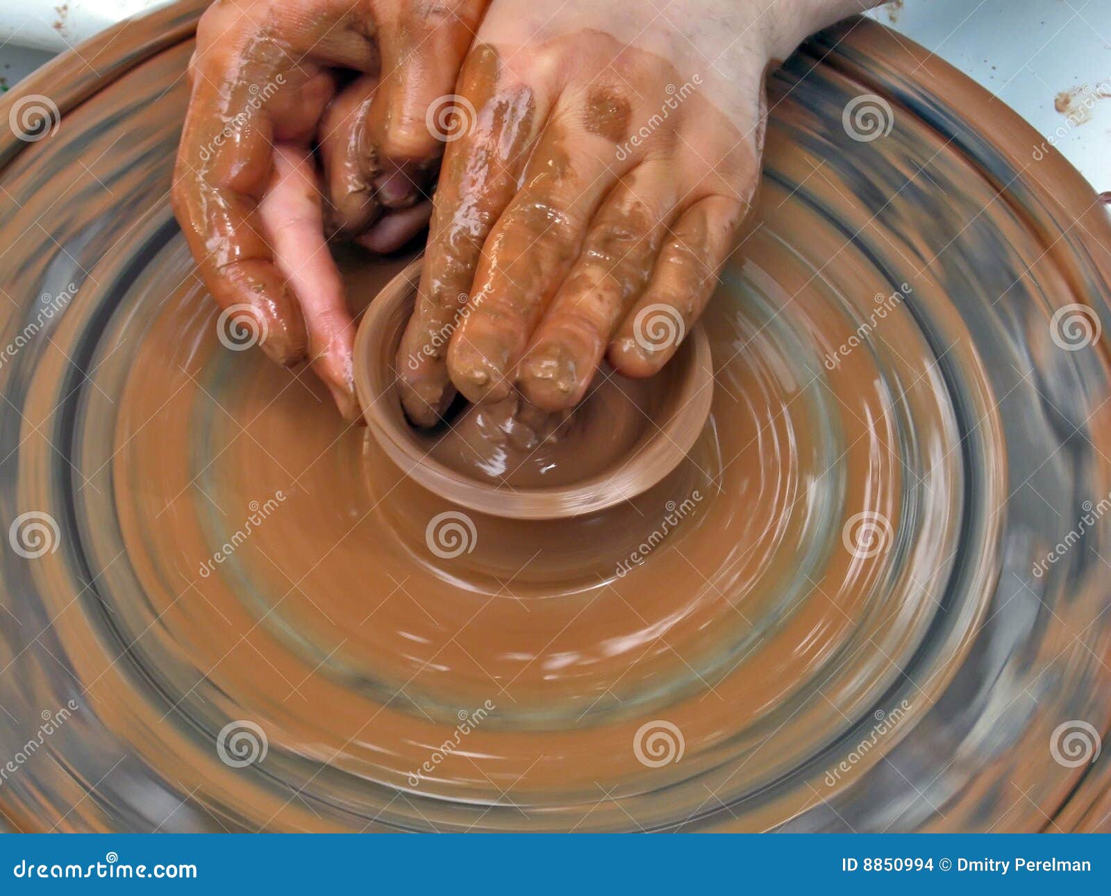 person using potters wheel