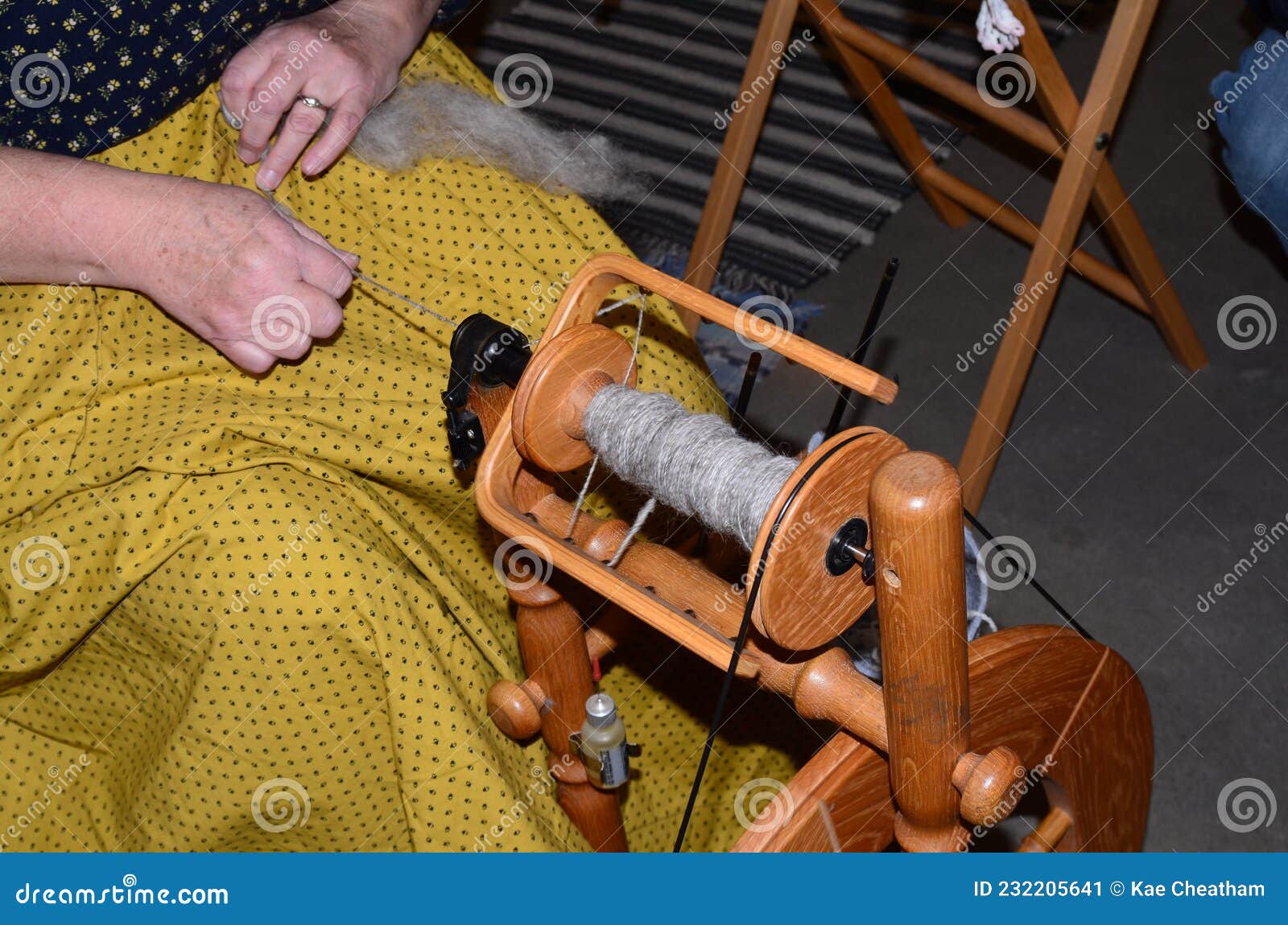 Art and Craft Person Using a Vintage Spinning Wheel Stock Image