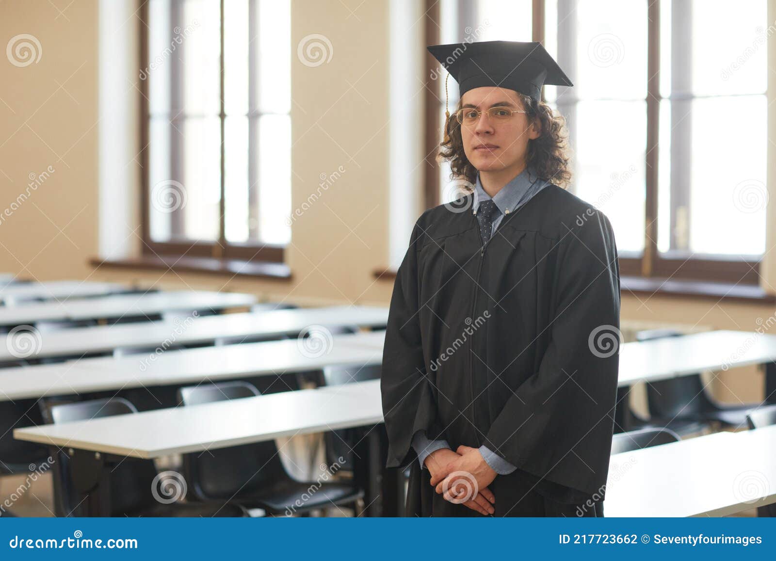 Happy Graduating Mixed Race Female Wearing Cap and Gown Cheering Isolated  on a White Background Stock Photo - Alamy