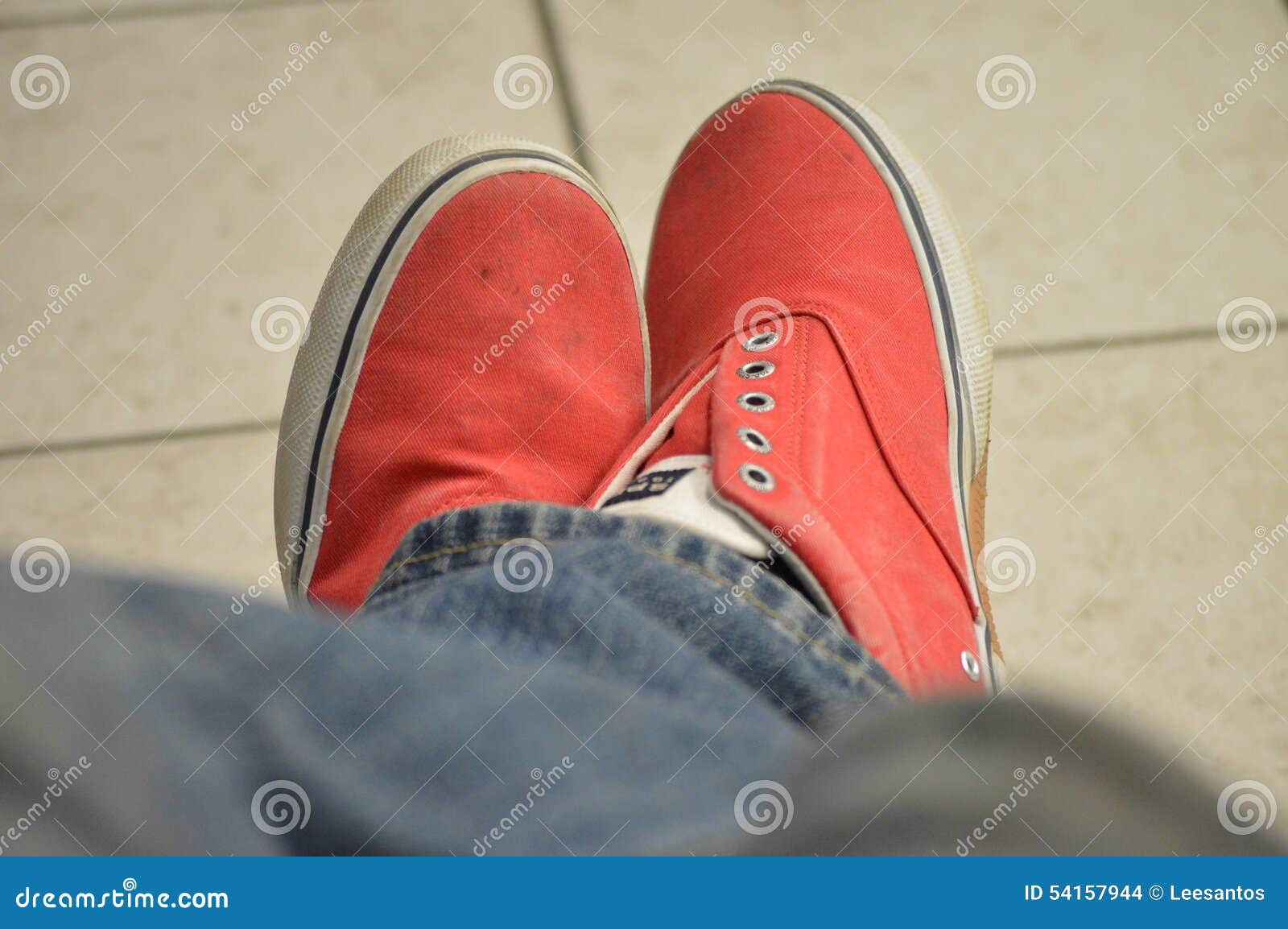 Person Wearing Red Shoes and Jeans Crossed Legs Stock Photo - Image of ...