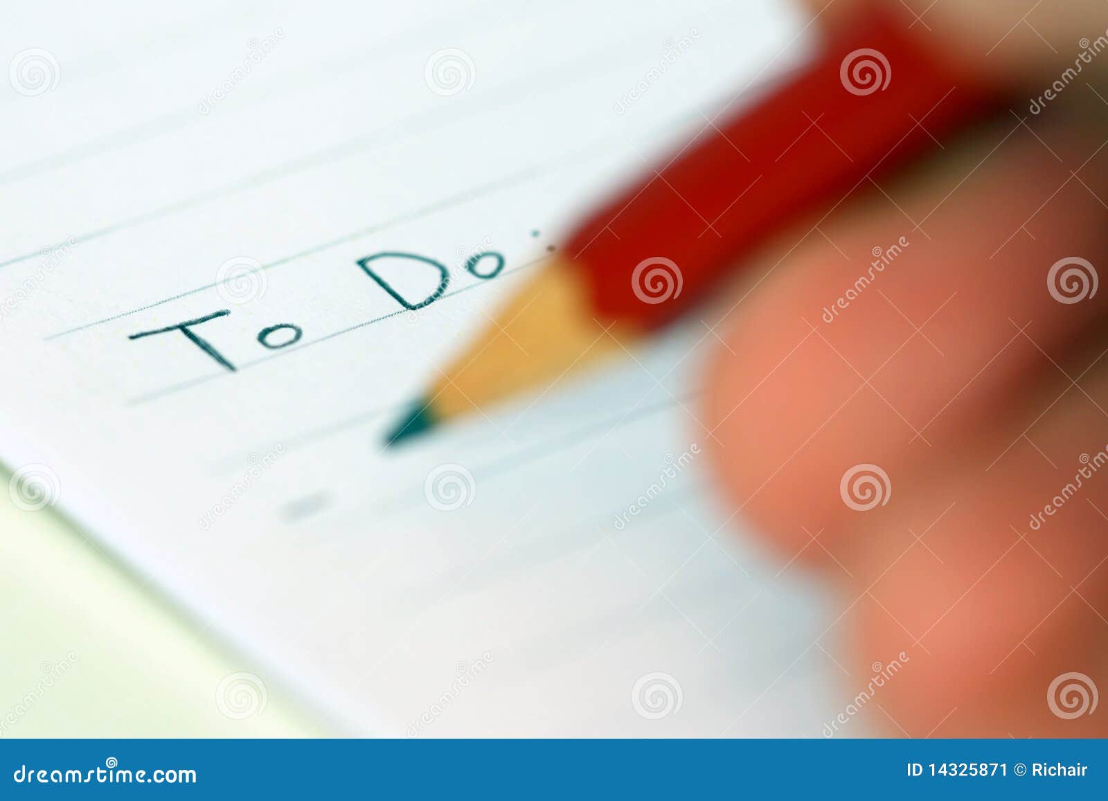 person writing to do list