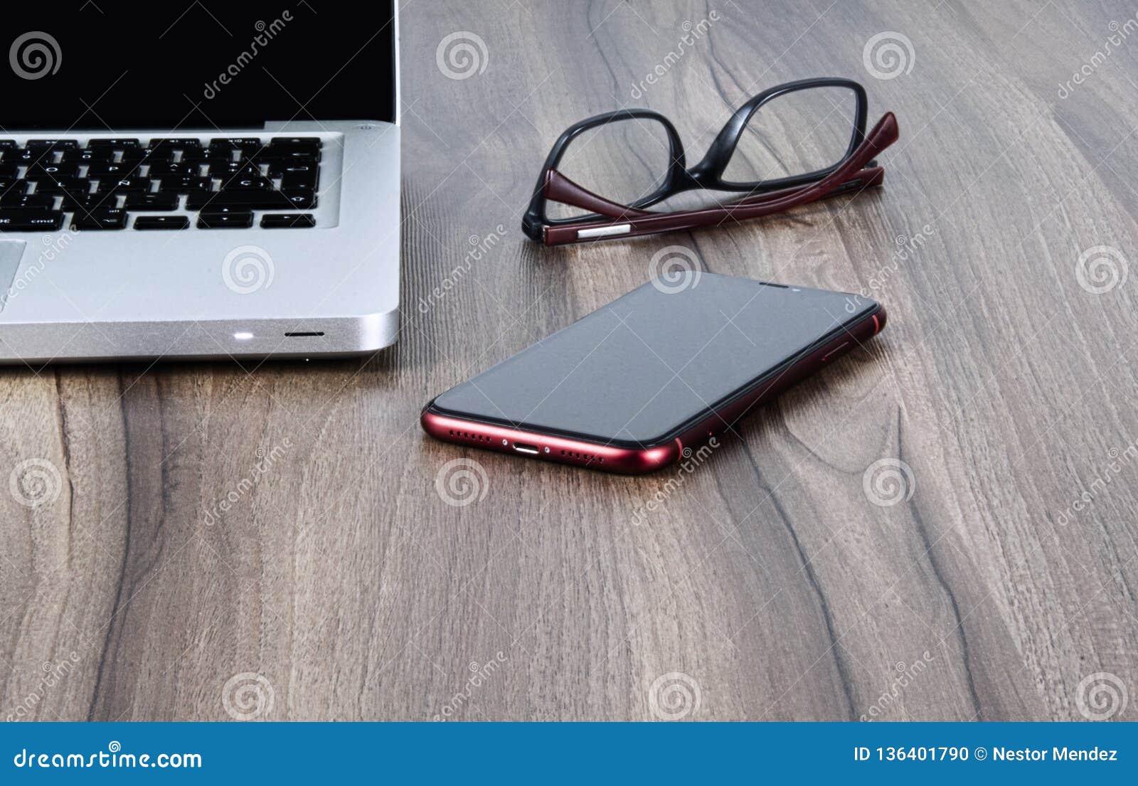 personal computer, glasses and cellphone on an office or study table