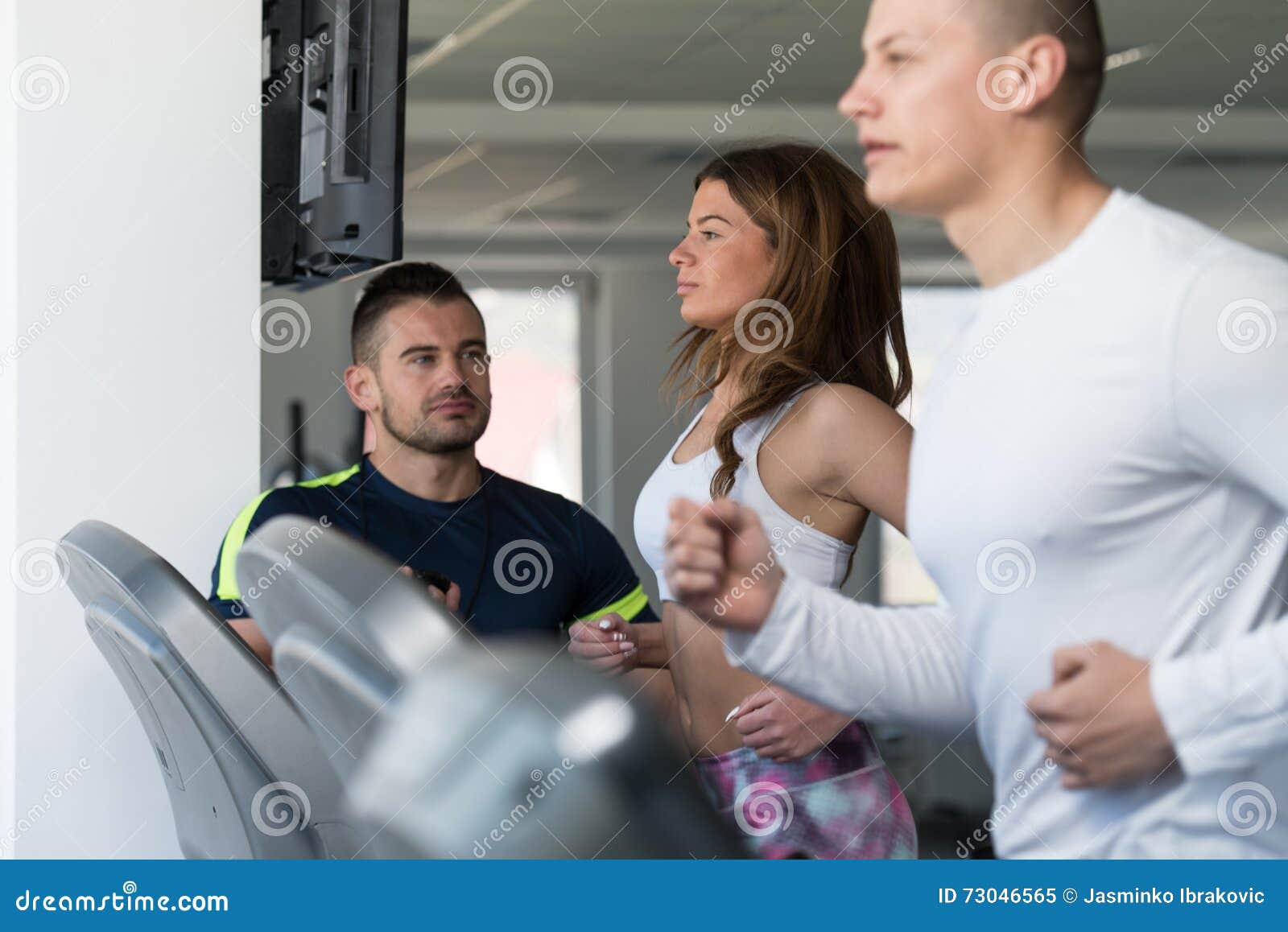 Personal Trainer And Client In Gym On Treadmills Stock Image Image Of