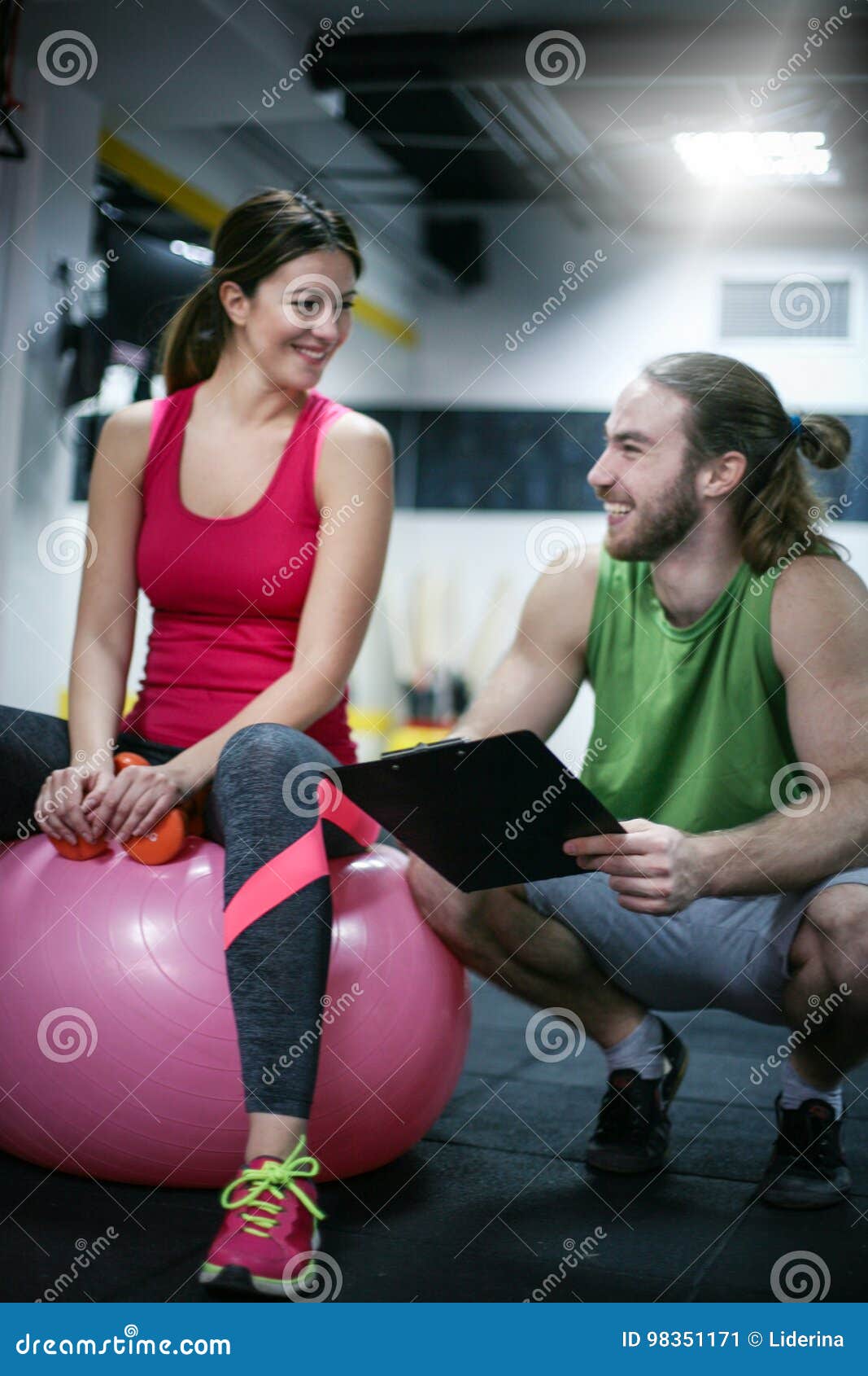 Personal Trainer Having A Training Consultation With A