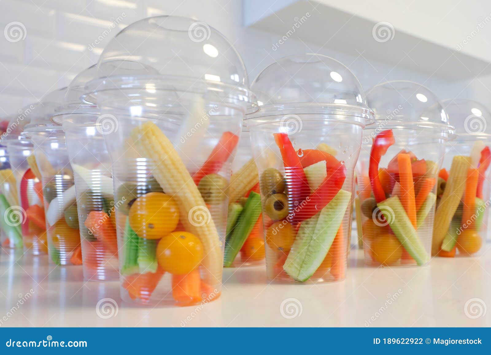 Personalized Vegetables in Plastic Cups. Safe Refreshments in the Days