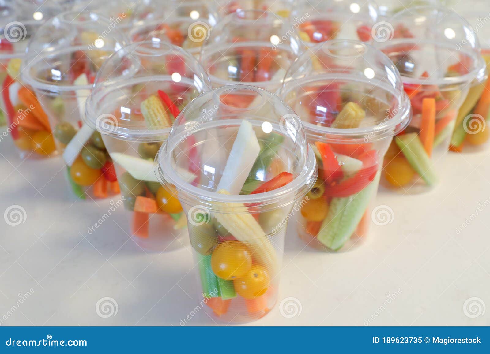 Personalized Vegetables in Plastic Cups. Safe Refreshments in the Days