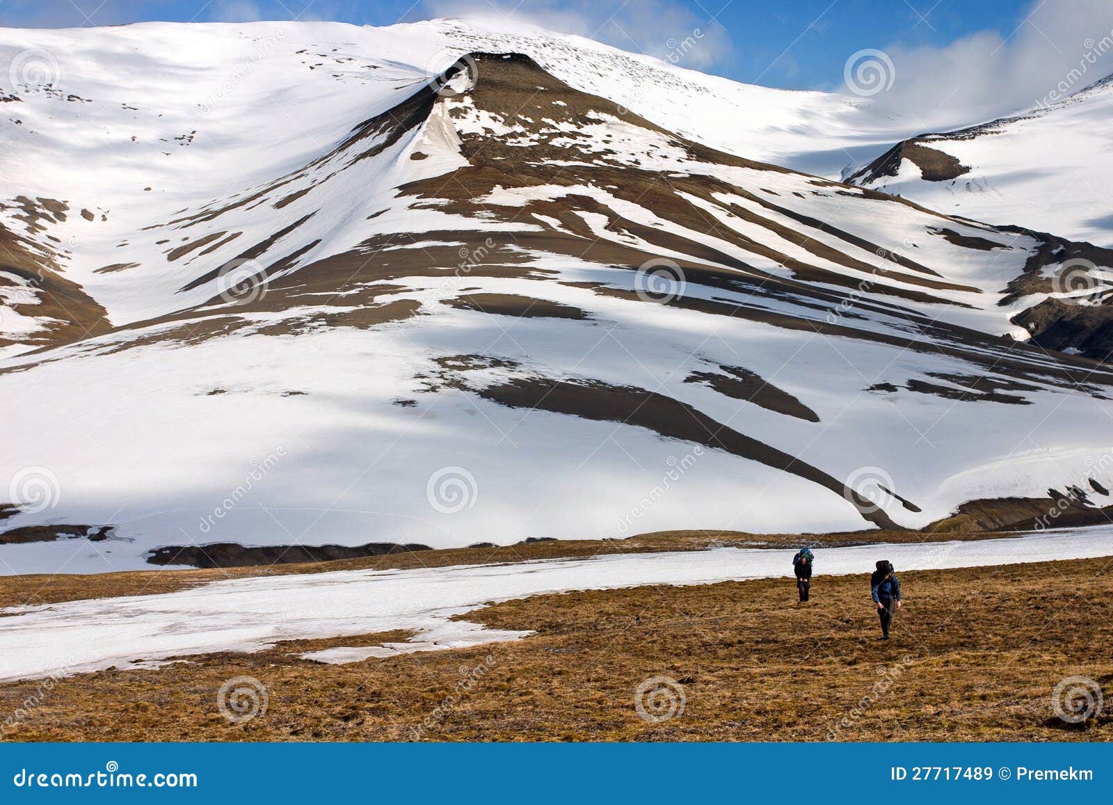 persons walking tundra in svalbard