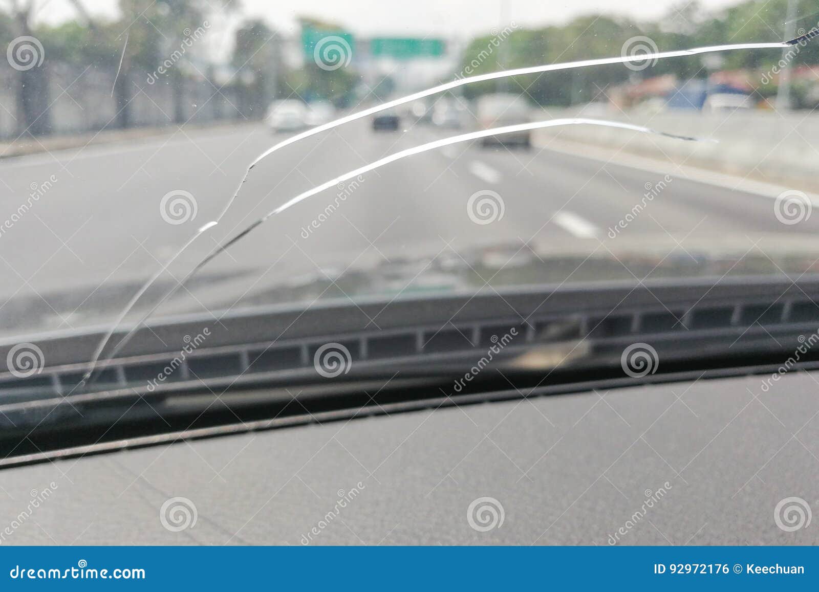 perspective view of cracked car windscreen or windshield while d