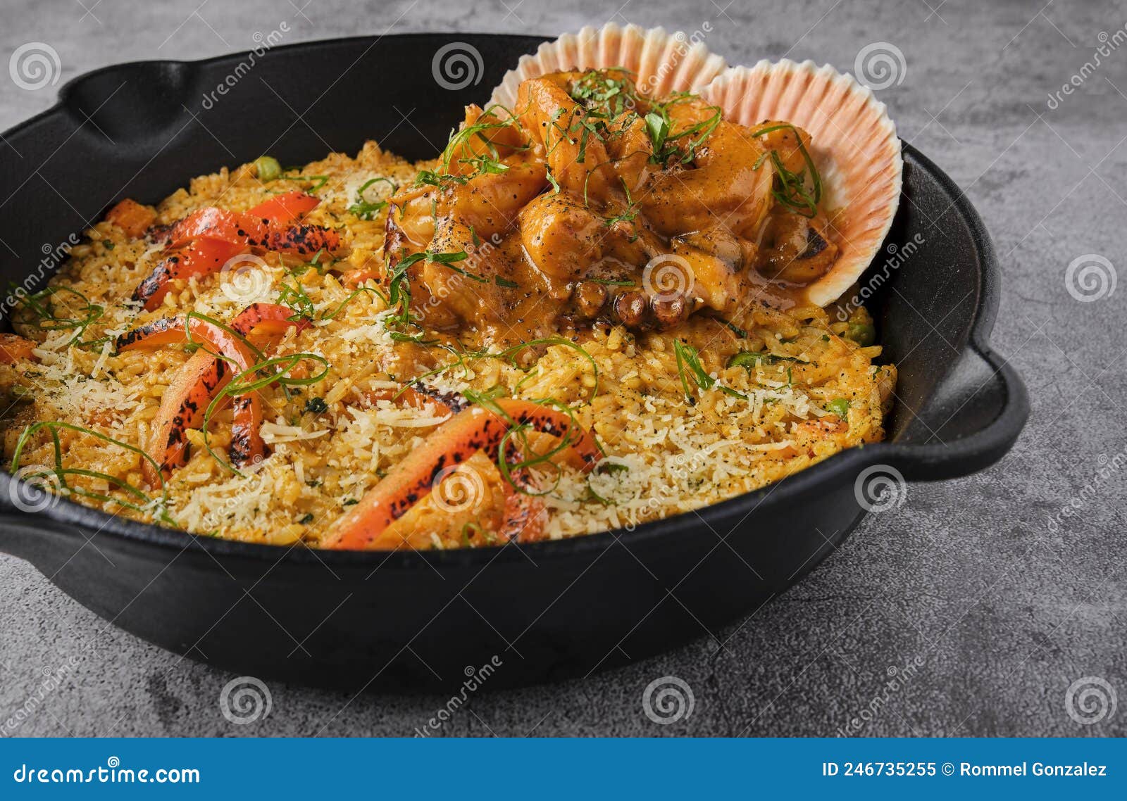 peruvian food: rice with seafood. arroz con mariscos, food served in pan, selective focus.