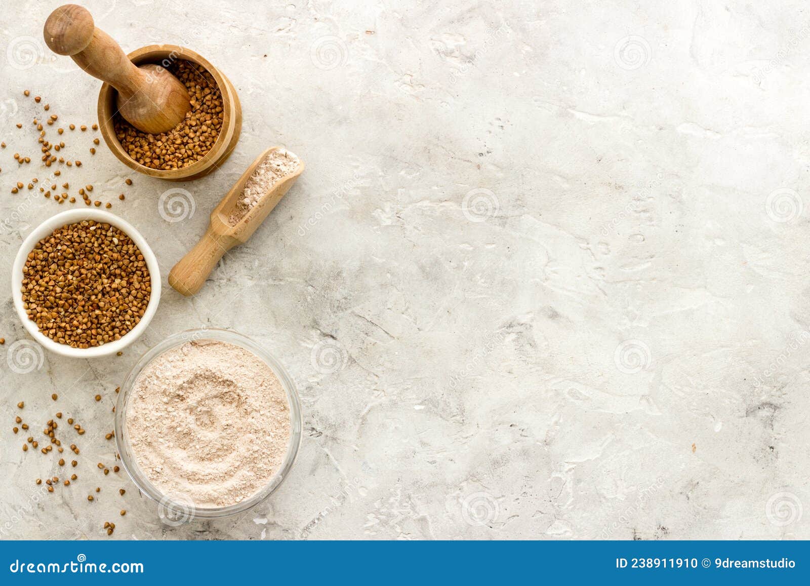 Pestle Buckwheat Flour Grains with Mortar on Kitchen Table Stock