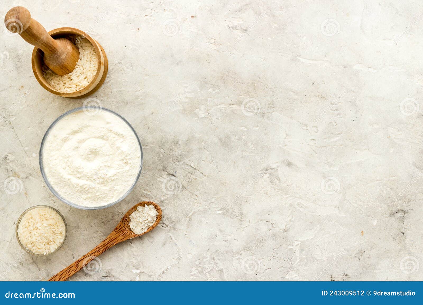 Pestle Rice Flour Grains with Mortar on Kitchen Table Stock Photo