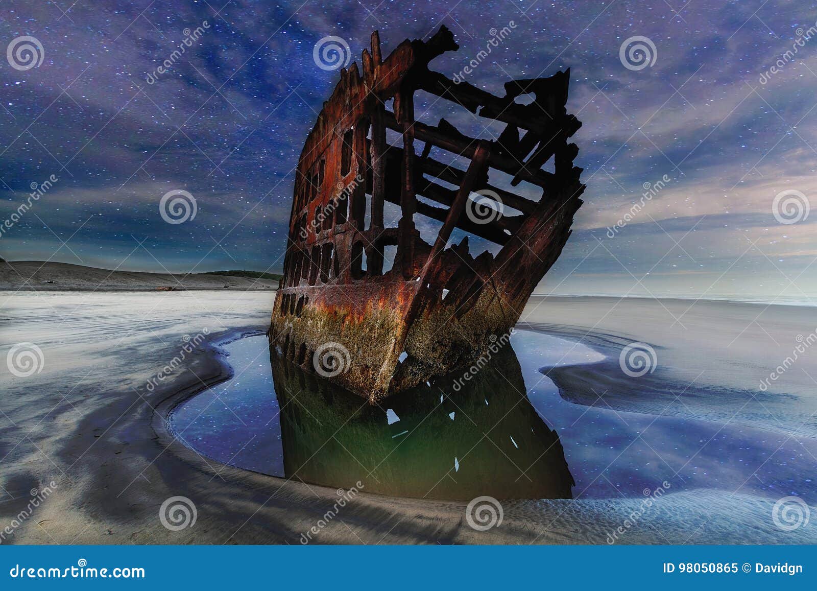 peter iredale shipwreck under starry night sky along oregon coast