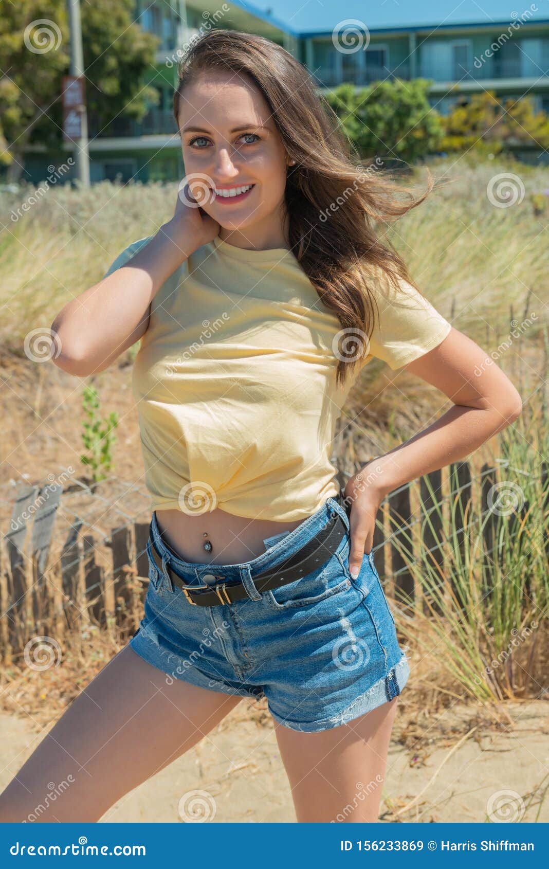 Brunette In Yellow And Blue On A Beach Stock Image Image Of 