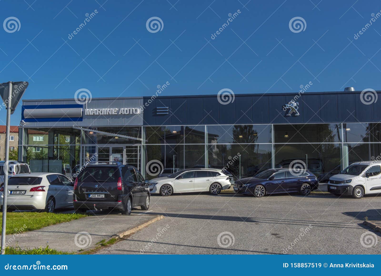 Peugeot Car Dealership And Cars In Front Of It Editorial